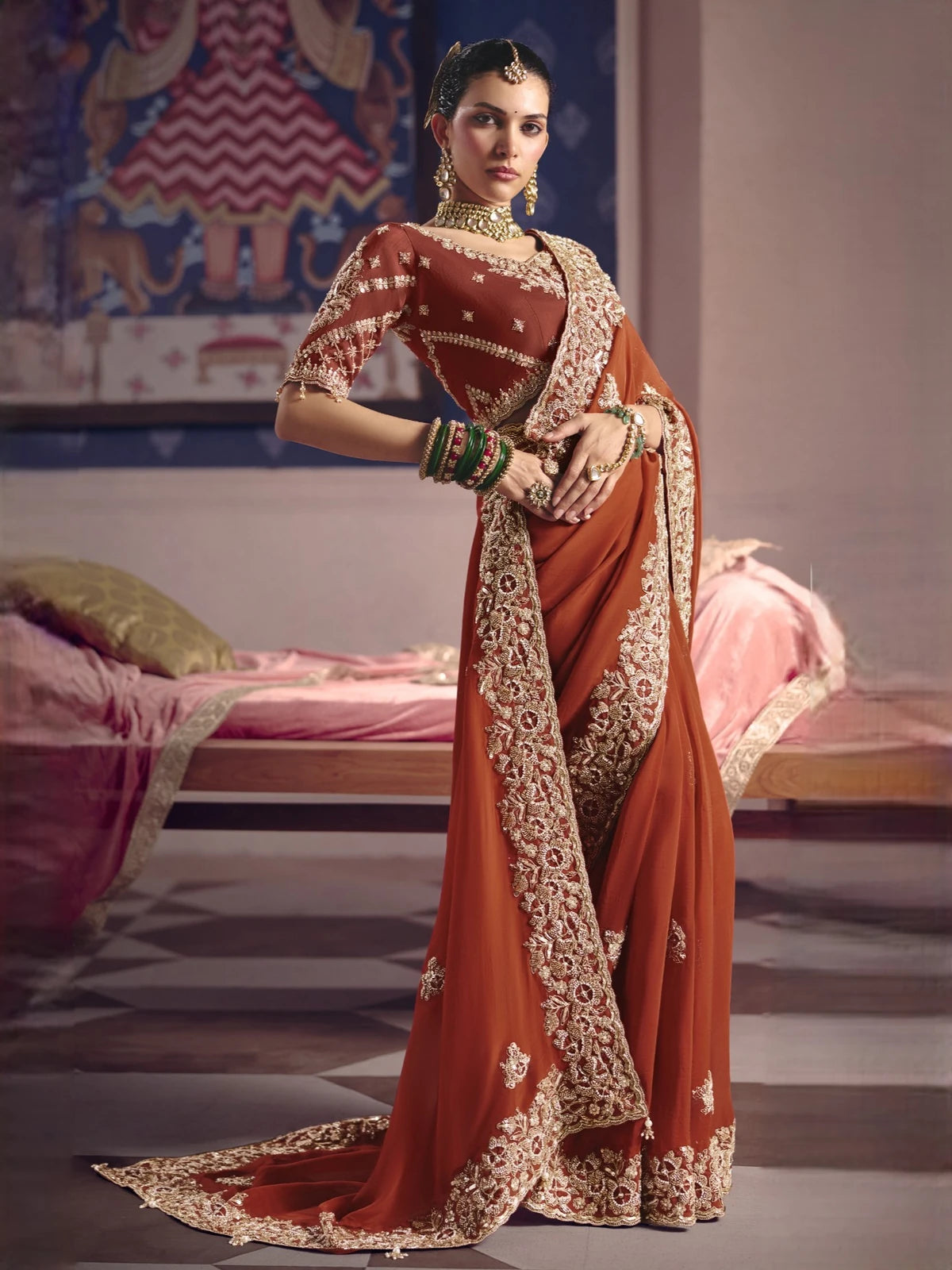 Tarani Supriya rust viscose zari tissue silk saree front view with festive embroidery and ornate border