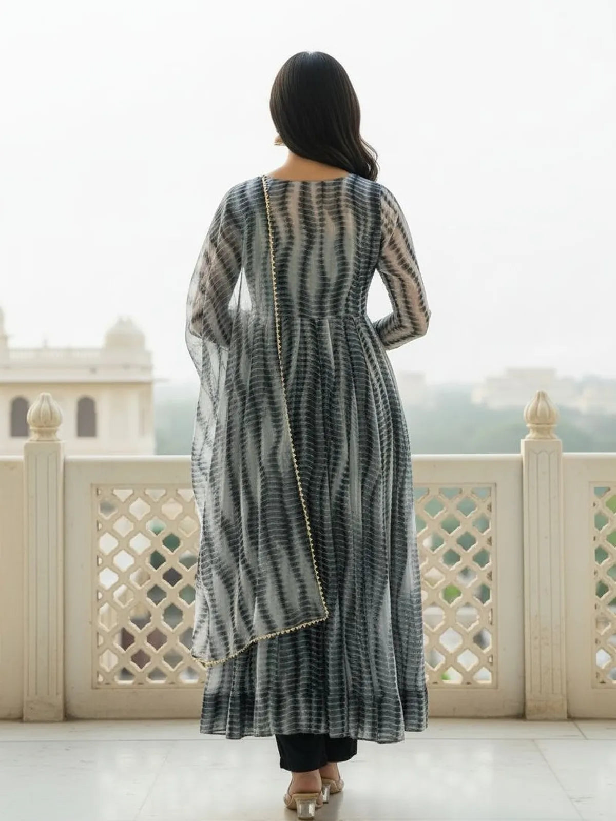 Tarani full back view of grey printed dress with flowing silhouette and lace trimmed dupatta