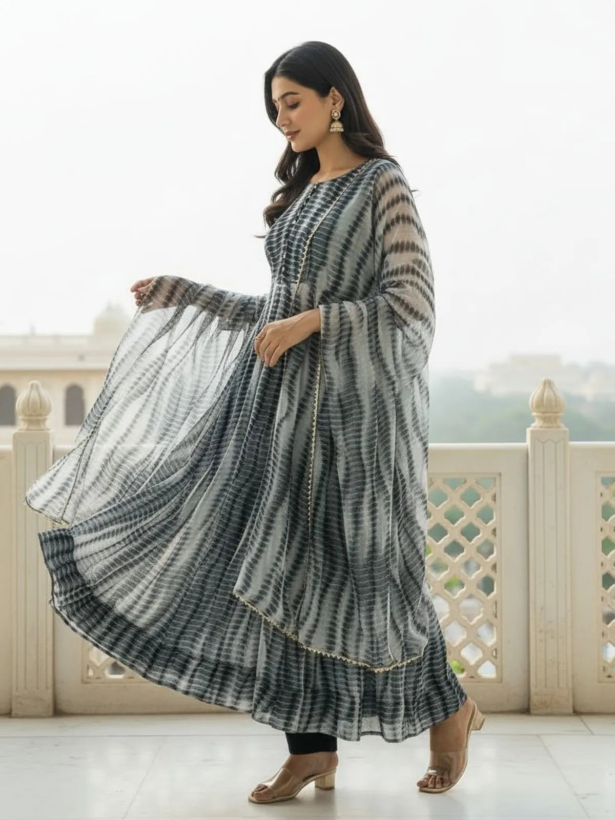 Tarani grey festive ethnic dress side profile with traditional flare and lace dupatta
