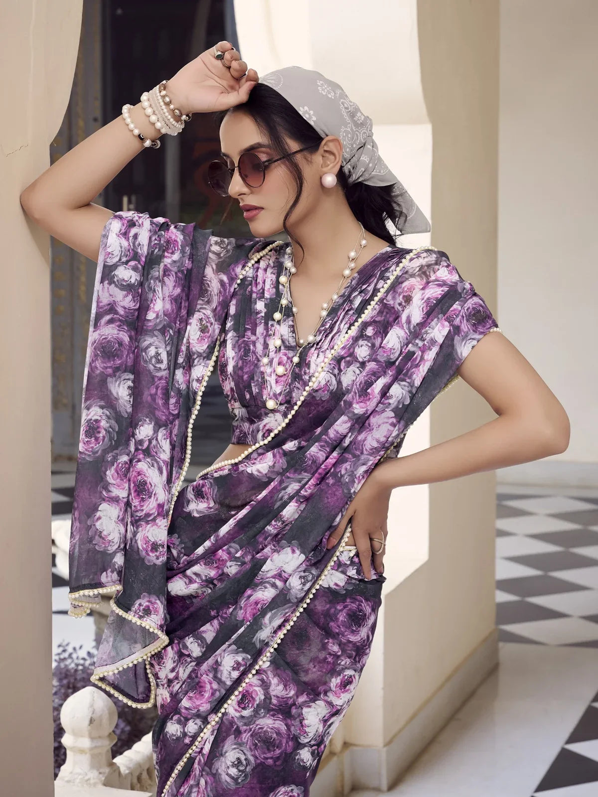 Tarani weightless marbal saree showing upper body pose with pearls and sunglasses