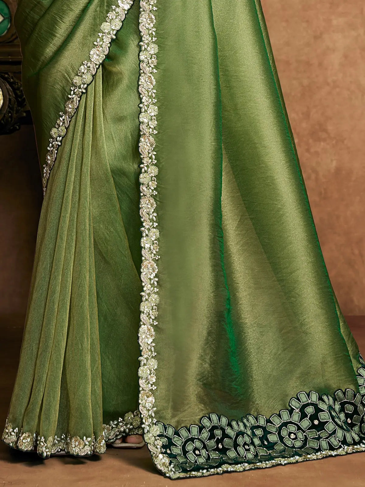 Tarani Rajashri green Zari Organza Satin saree pallu view featuring floral applique border and drape details