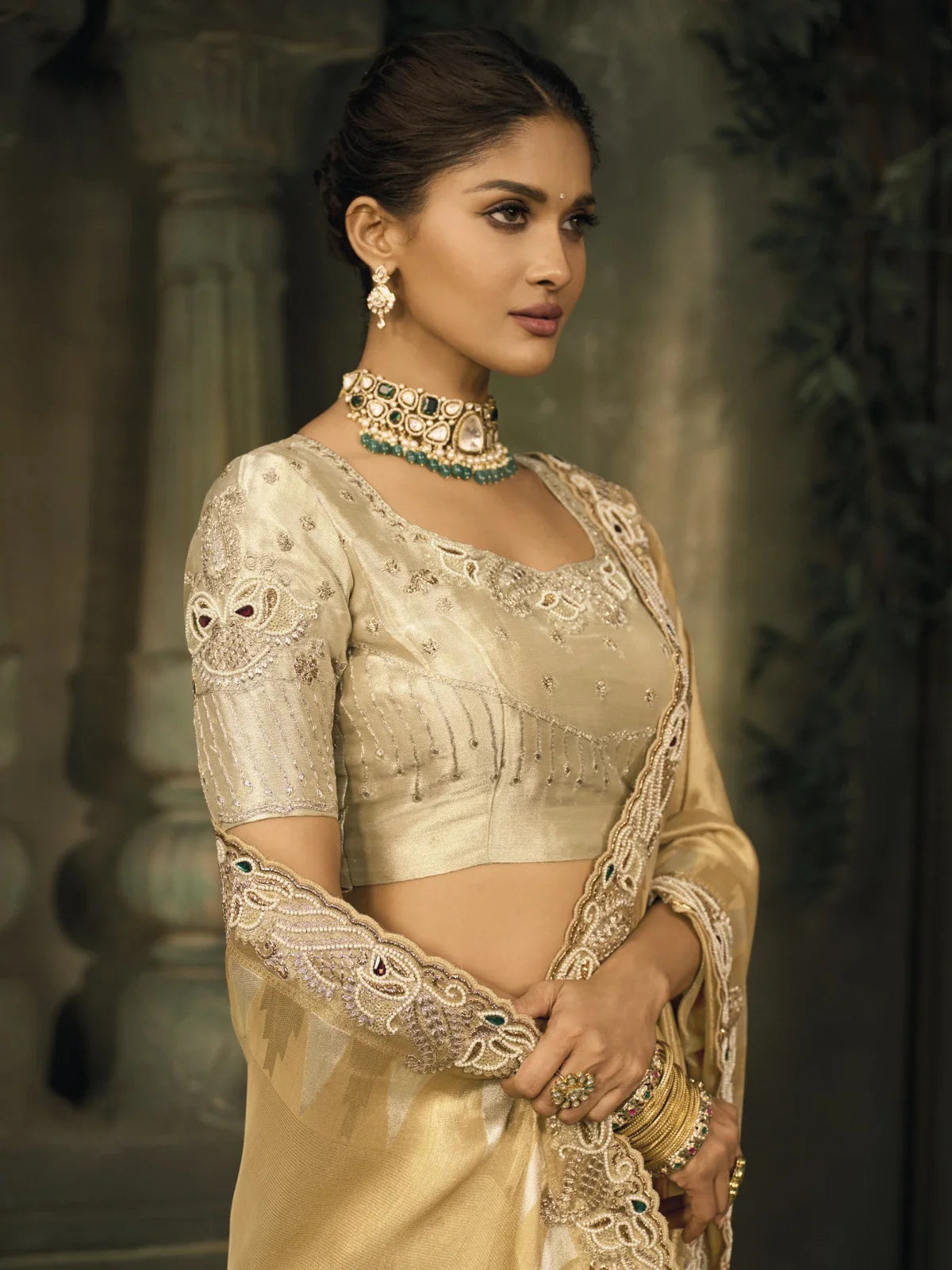 Tarani golden Ziraf Silk saree showing mirror work and blouse detailing in upper-body view