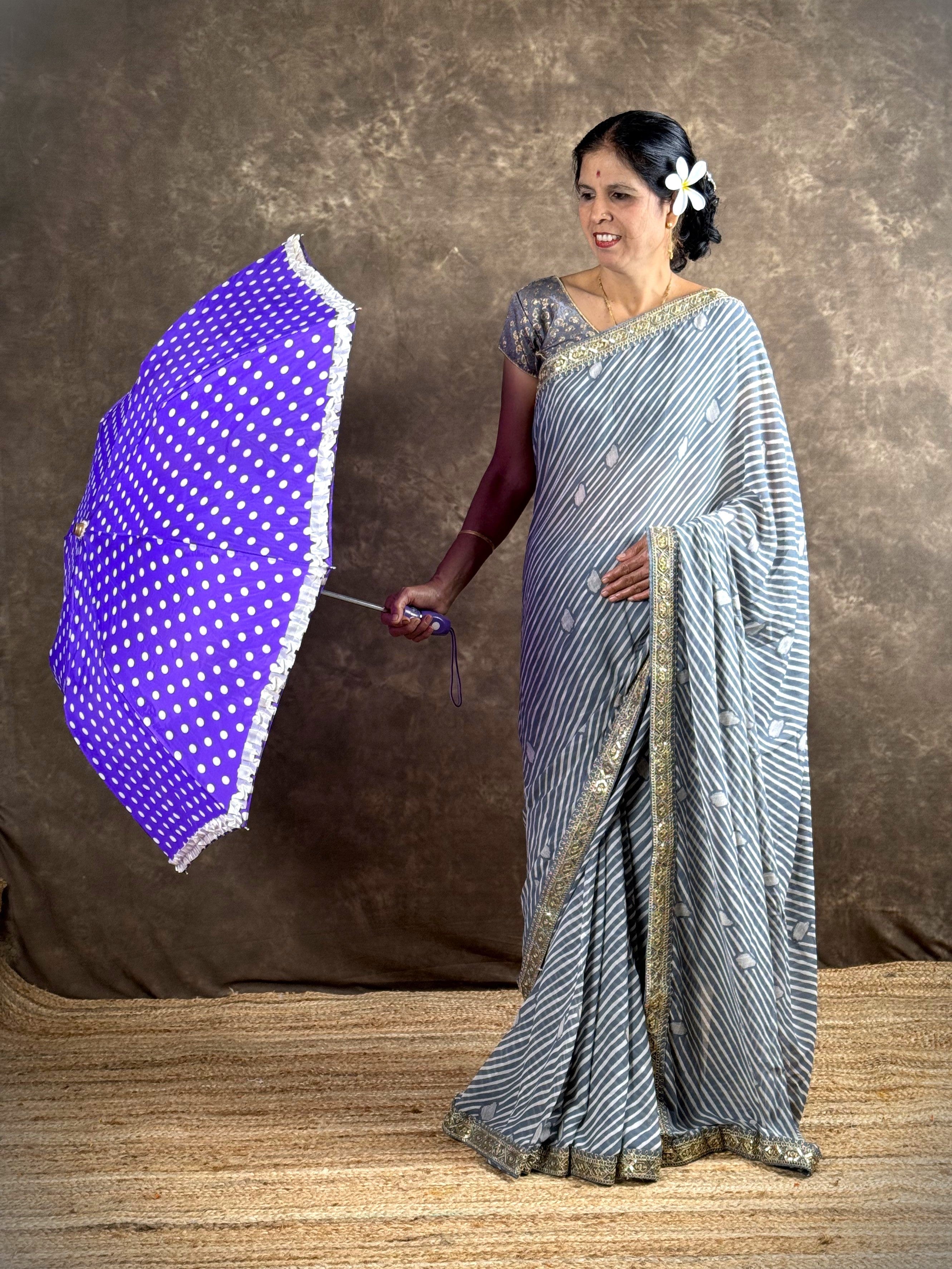 Tarani grey georgette saree side pose with umbrella styling