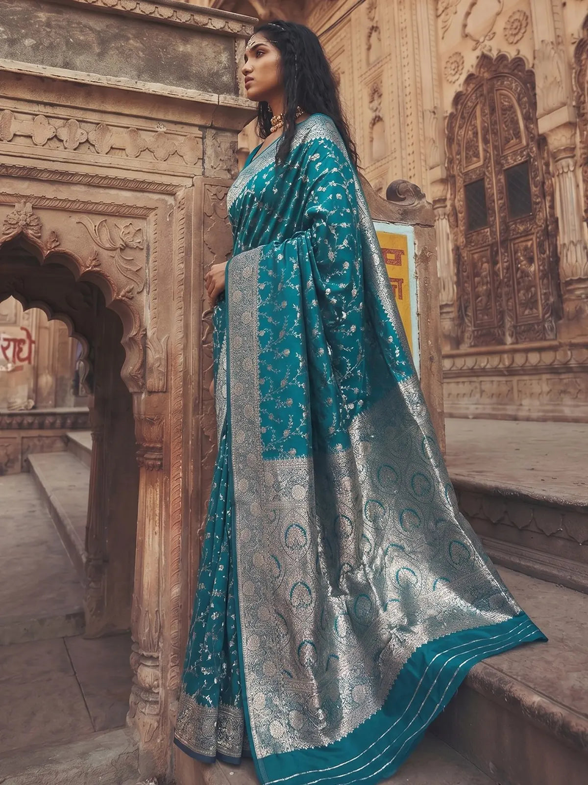 Tarani Ekveera teal art silk saree side view showcasing zari woven pallu and border
