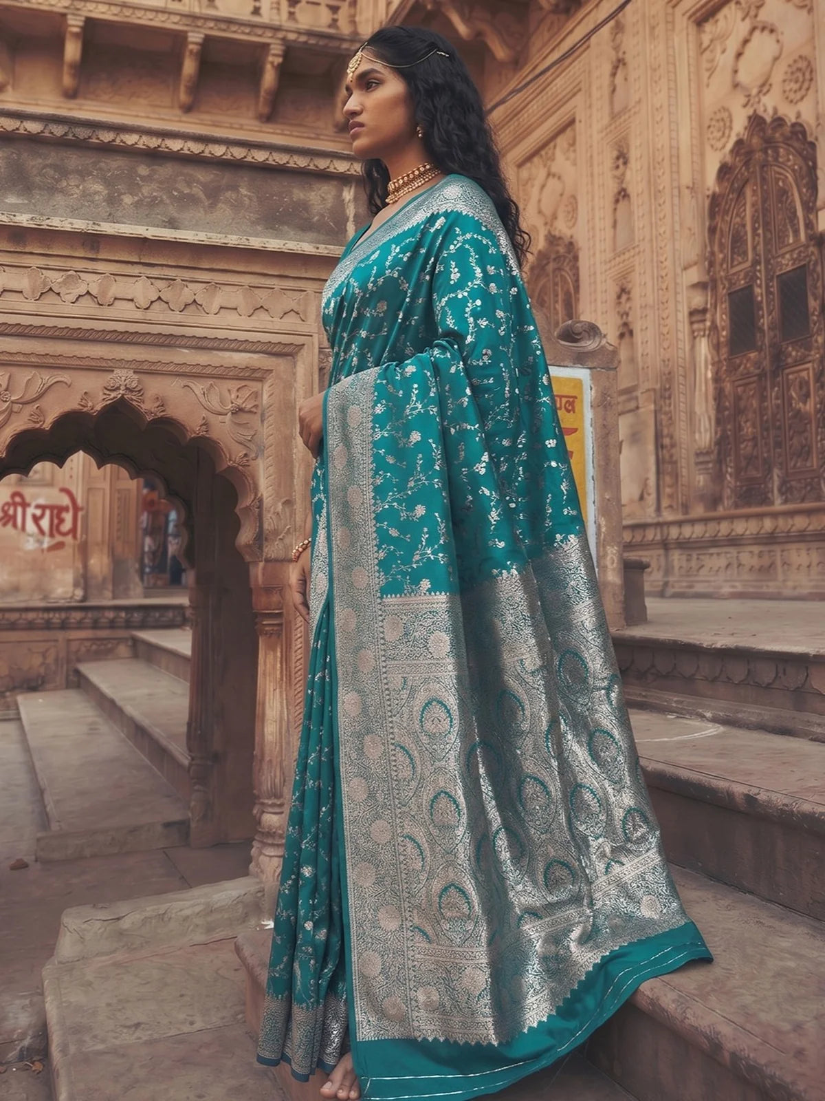 Tarani Kanika teal Art Silk saree side view with intricate zari weaving and flowing drape