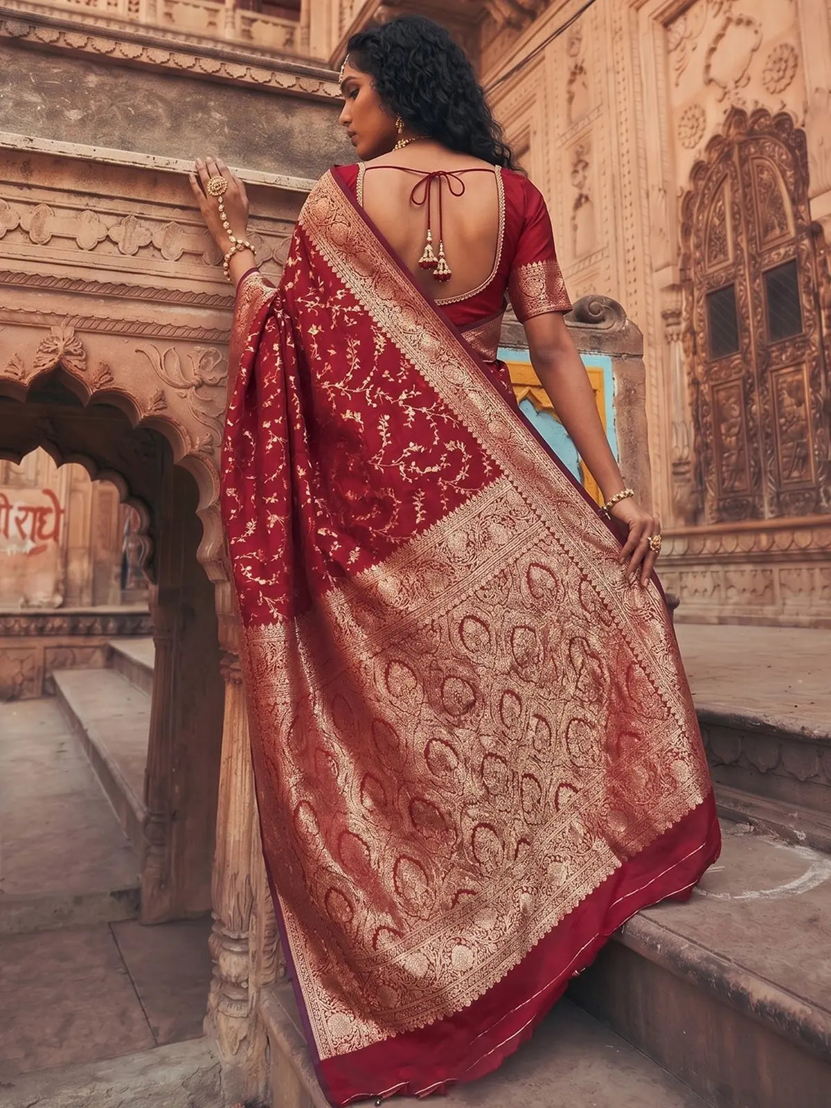 Tarani Joshika maroon art silk saree back view with designer blouse and rich zari woven pallu
