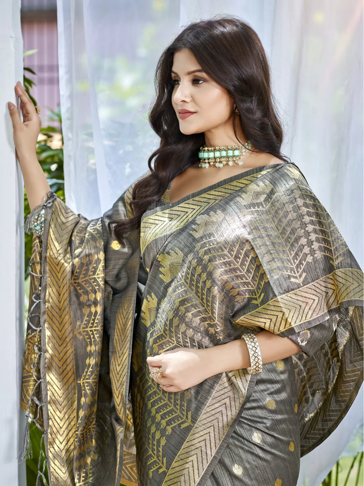 Tarani elegant grey Assam silk saree upper body closeup with zari border