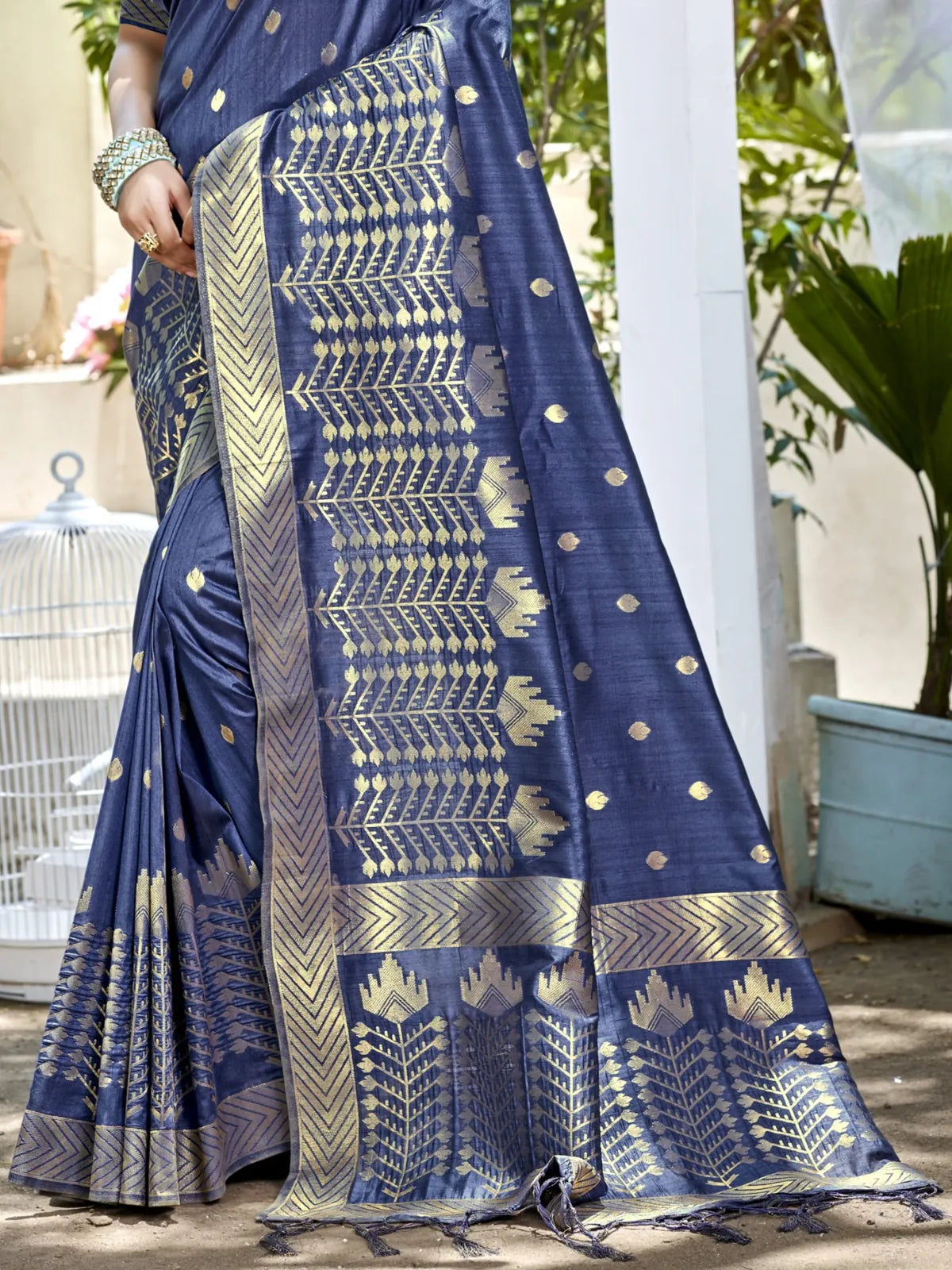Tarani navy blue Assam silk saree pallu closeup highlighting elegant woven border