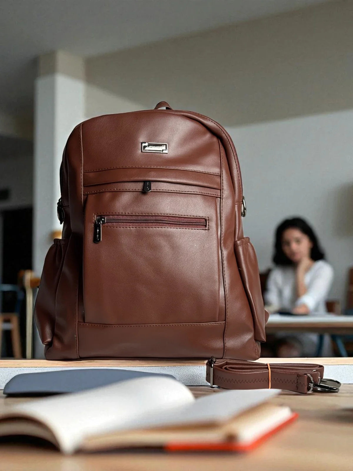 Tarani brown PU leather backpack elegant front design for office and casual use