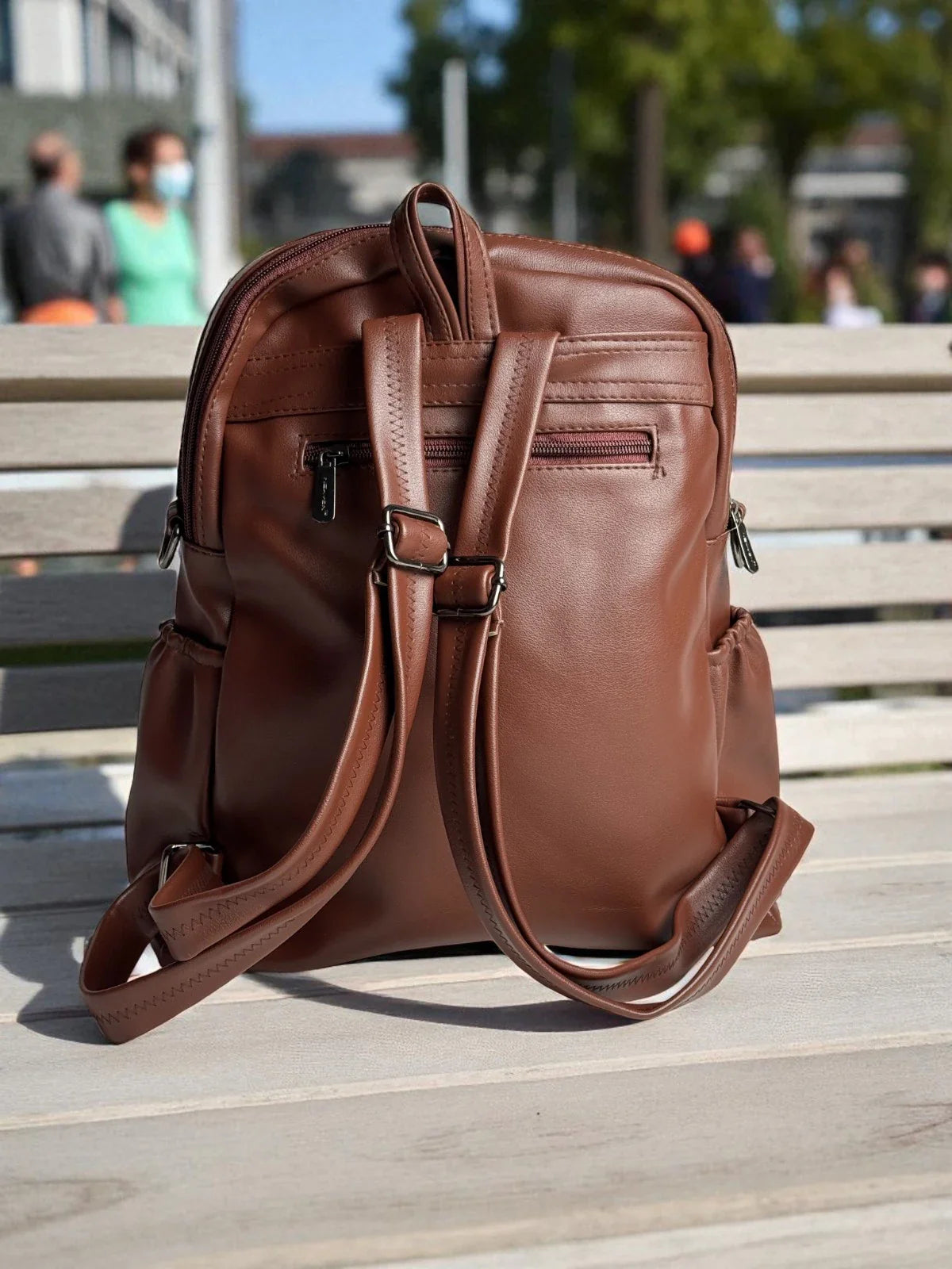 Tarani brown PU leather backpack back view with adjustable straps