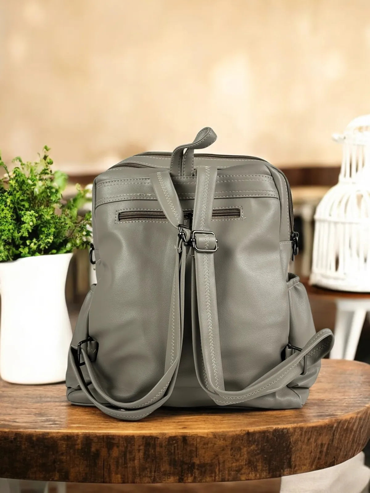 Tarani grey PU leather backpack back view with straps