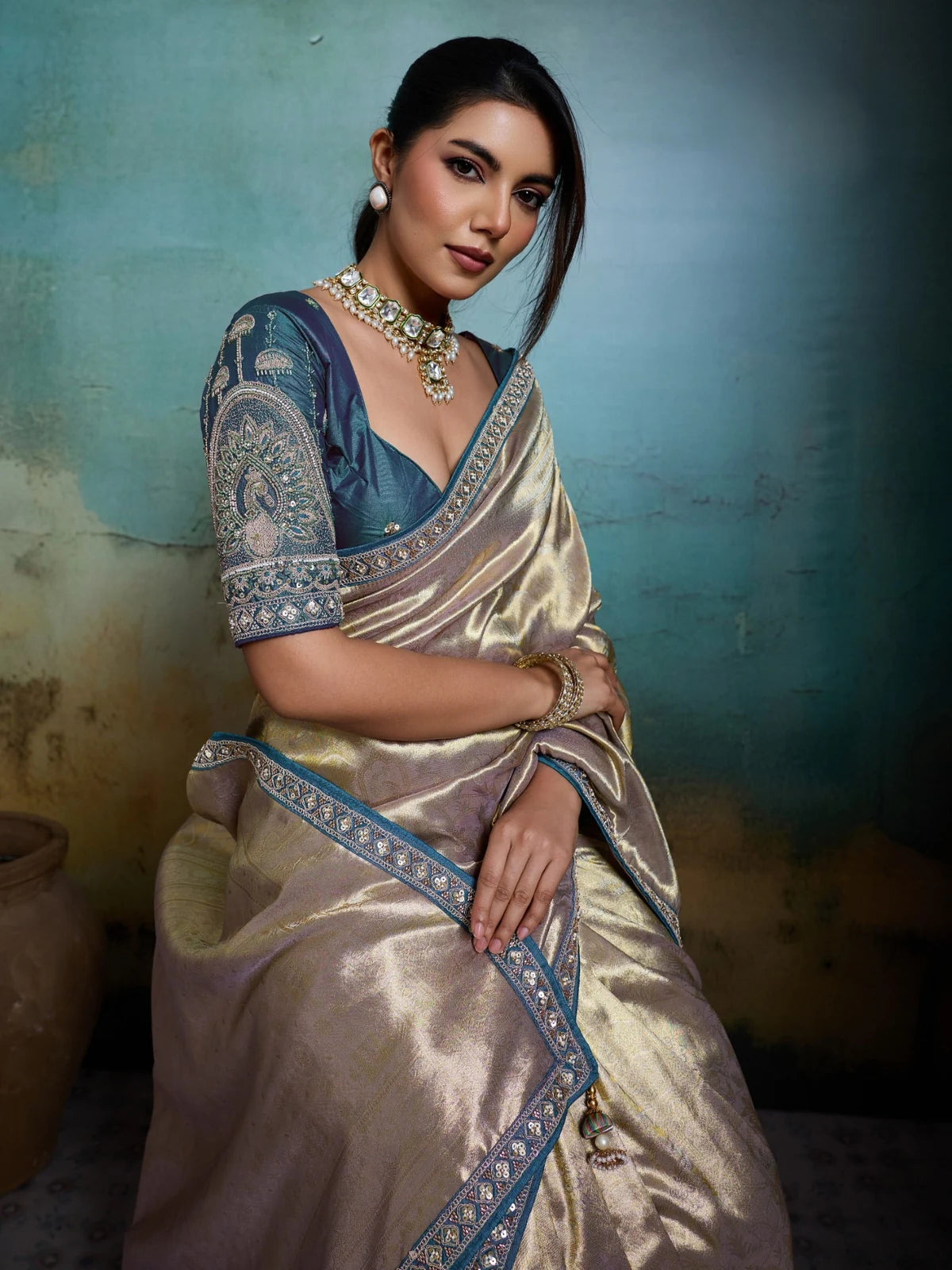 Tarani elegant golden Banarasi saree side pose with handcrafted border detailing
