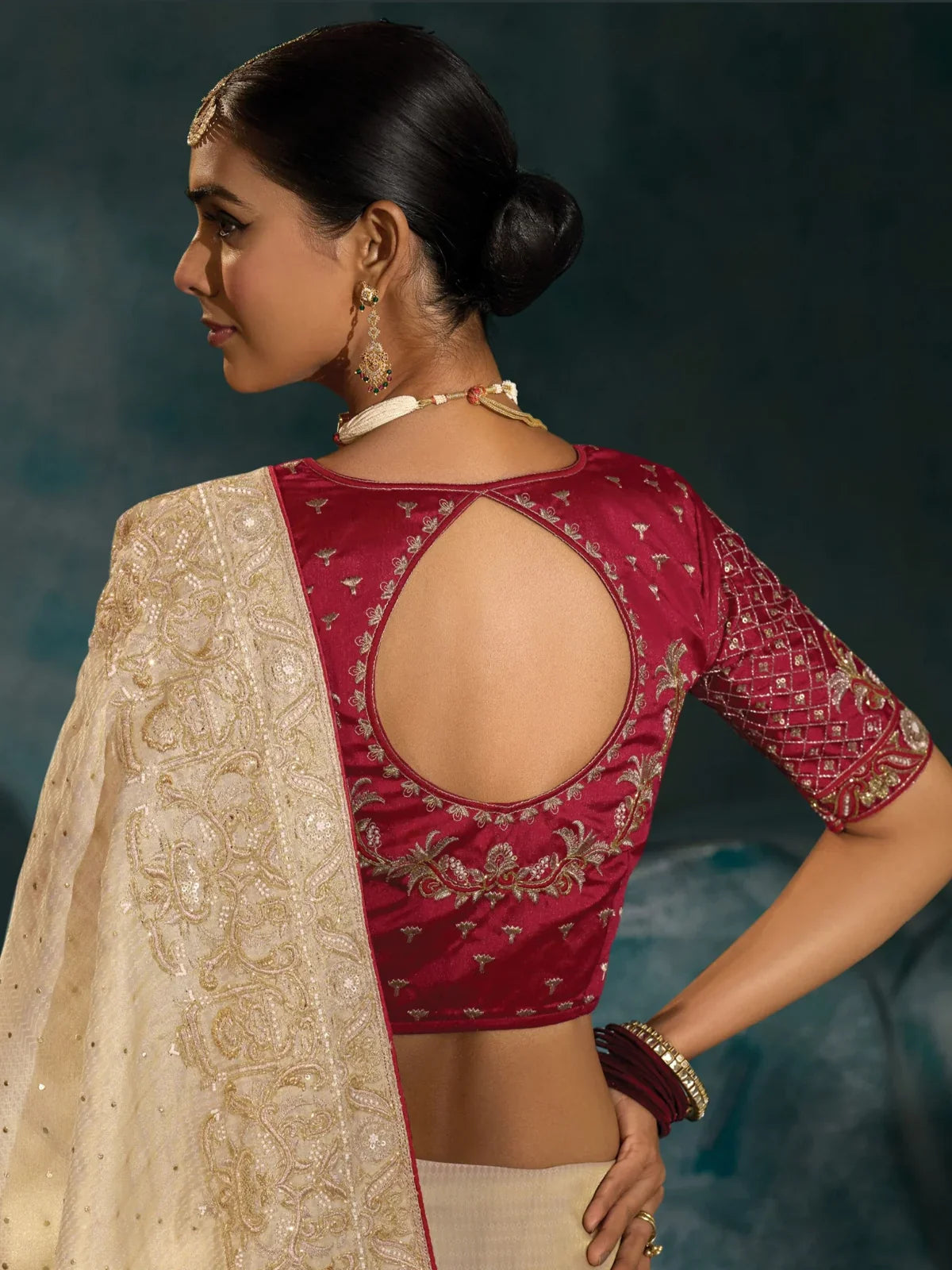 Tarani off white banarasi saree back blouse view with maroon embroidered blouse design