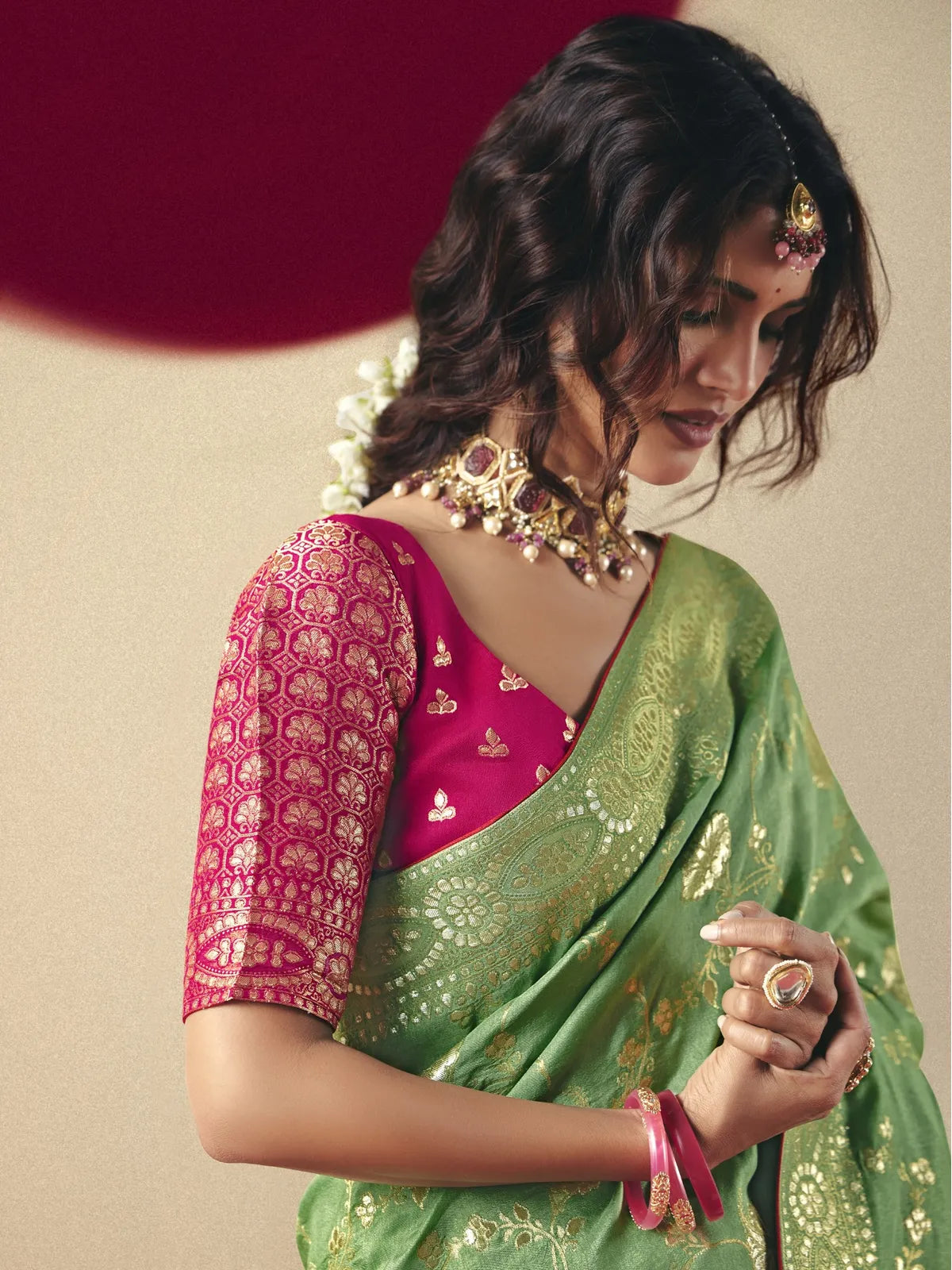Tarani green bemberg viscose saree side pose showing intricate zari weaving and festive appeal