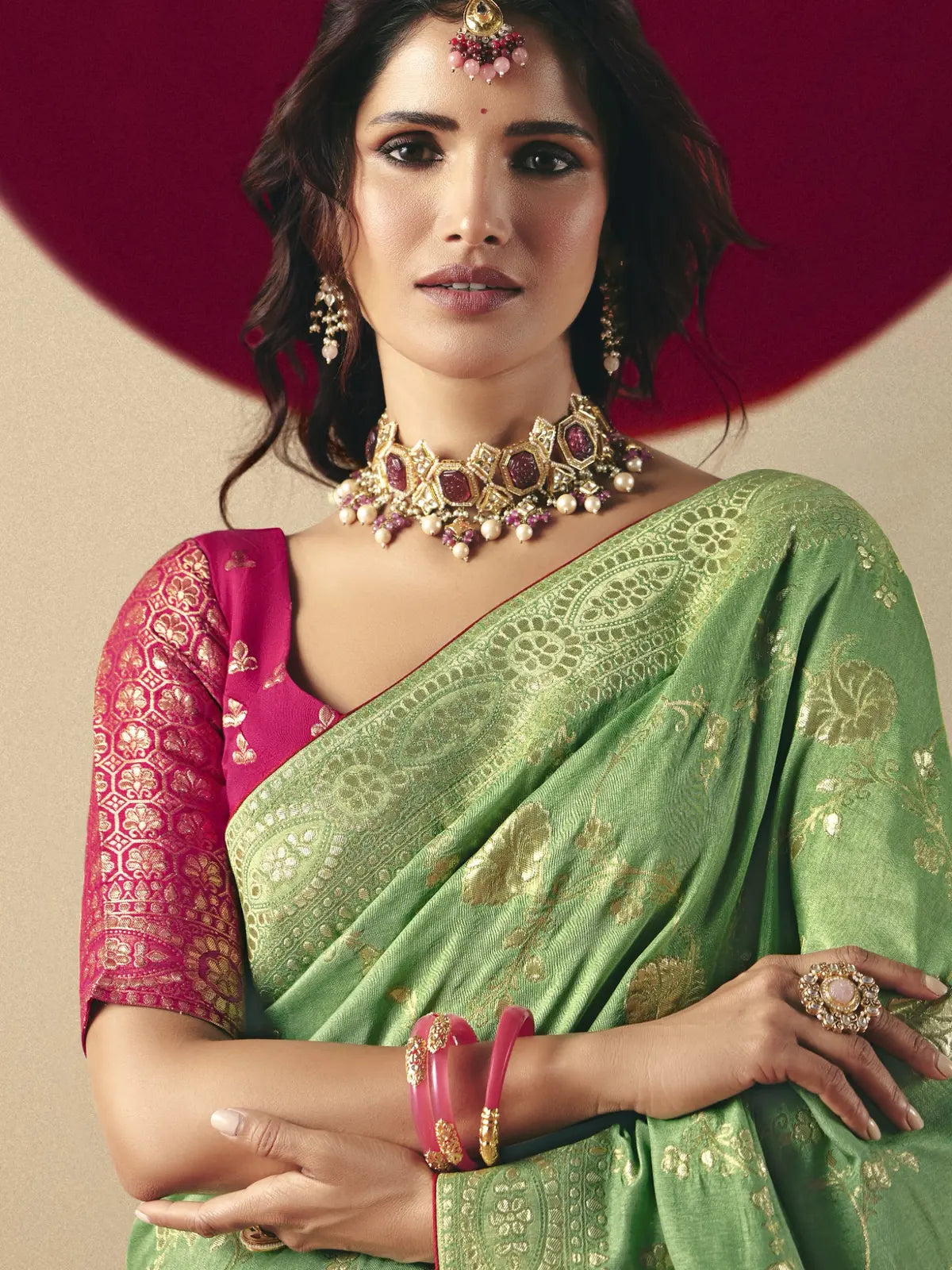 Tarani green bemberg viscose saree upper body view with rich pink blouse and designer jewelry