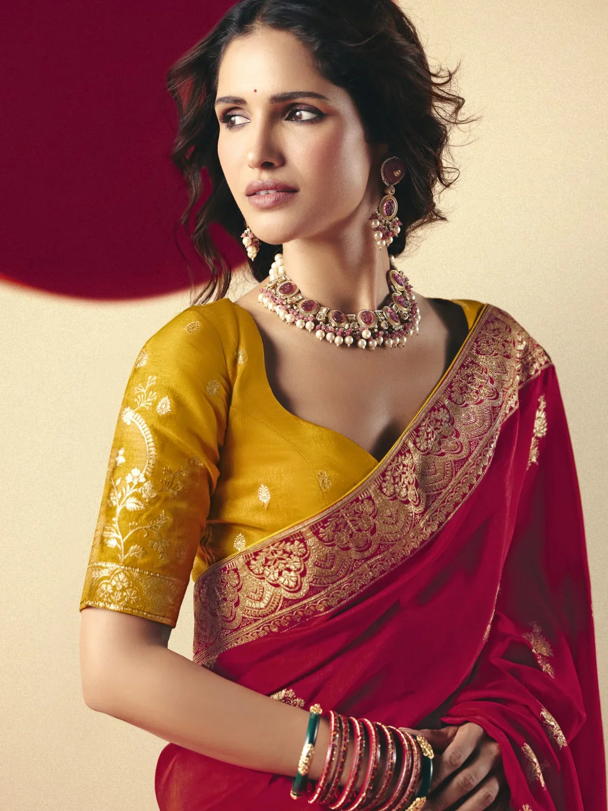 Tarani red bemberg viscose saree upper body view with golden border and jewelry styling