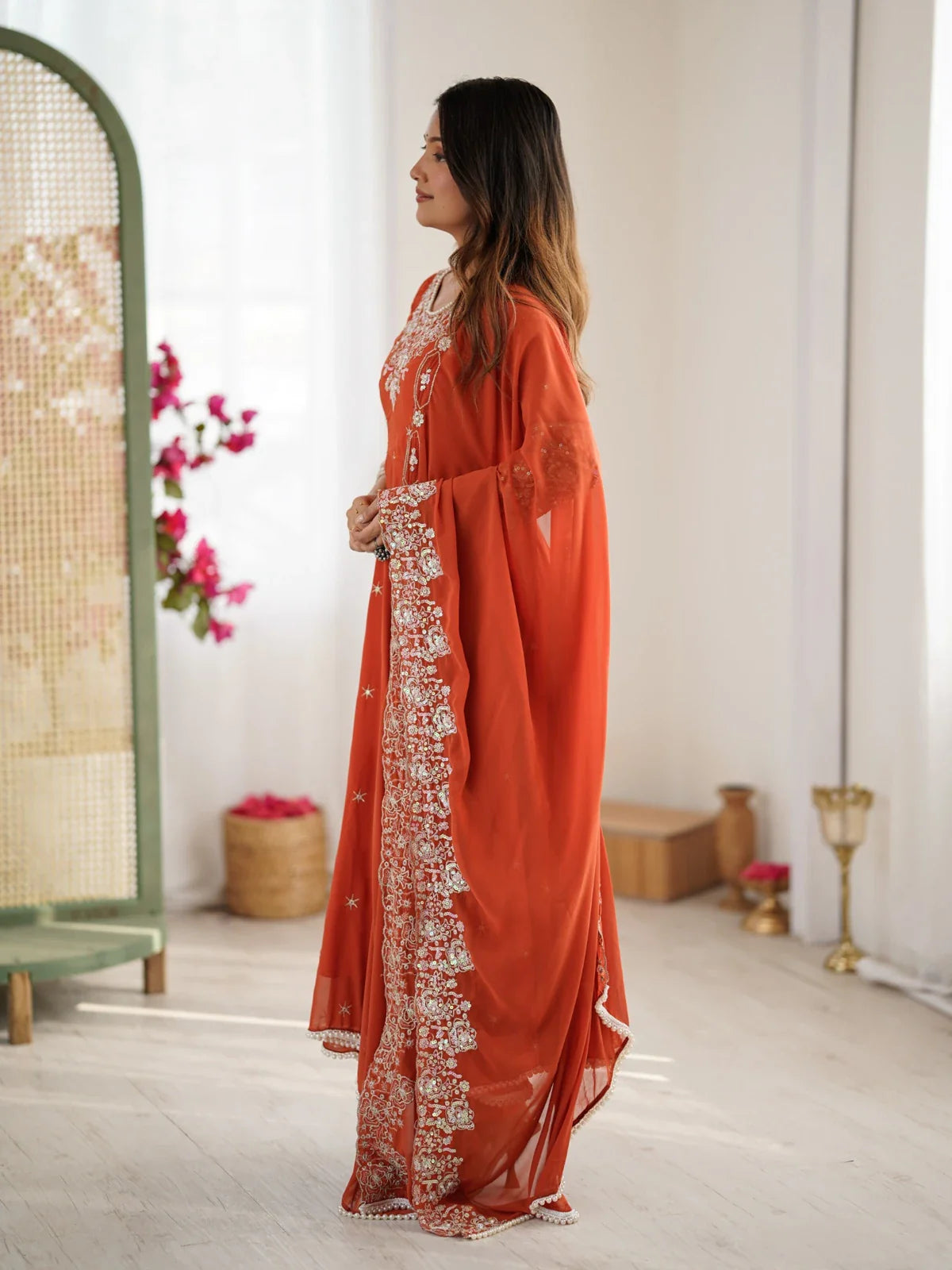 Tarani orange blooming faux anarkali side pose highlighting dupatta embroidery and flowy flair