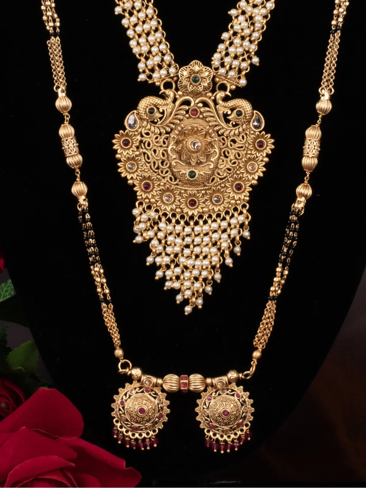 Tarani closeup view of gold plated bridal necklace with intricate design and pearls