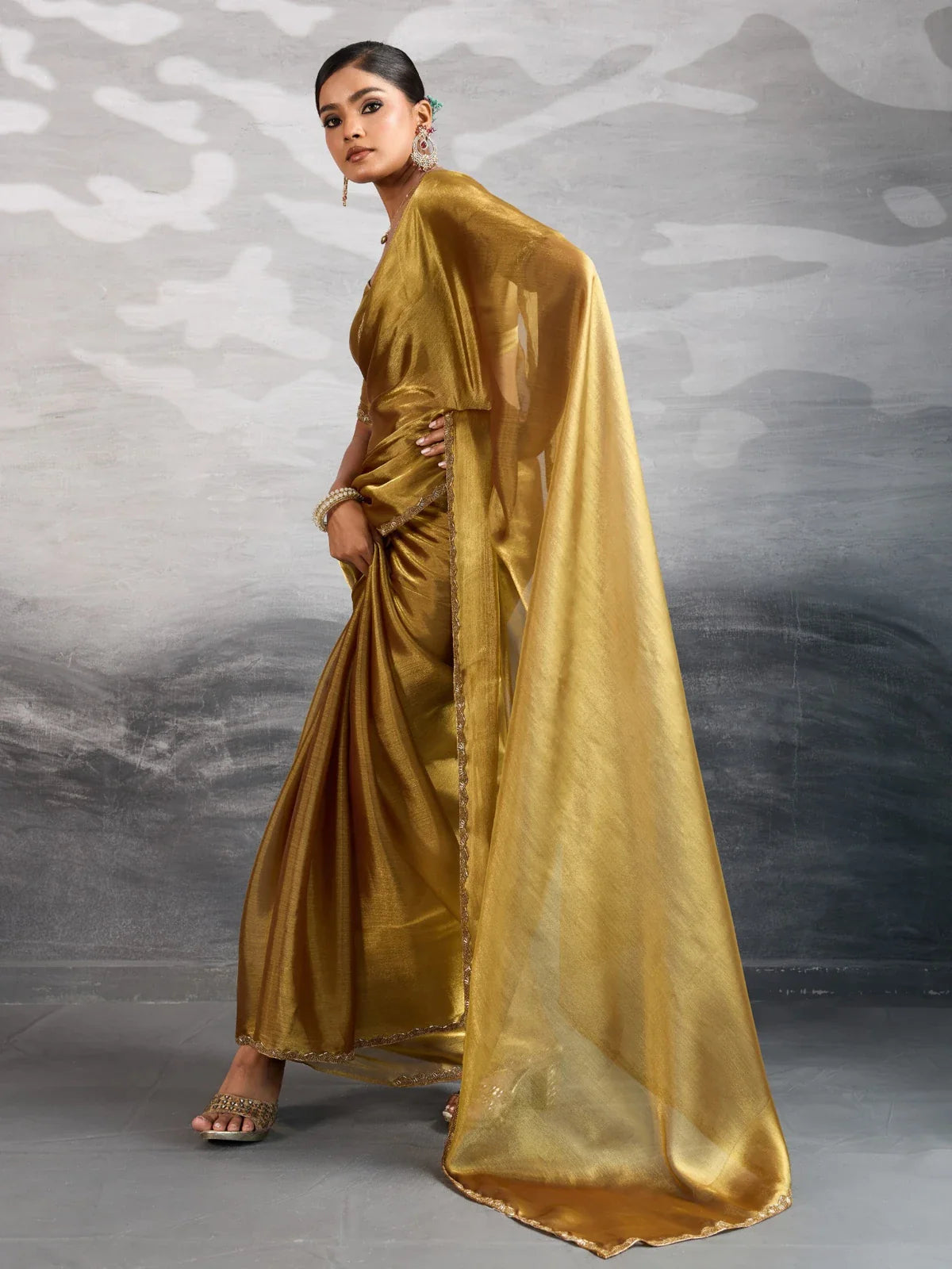 Tarani golden chiffon saree with applique lace border elegant side pose