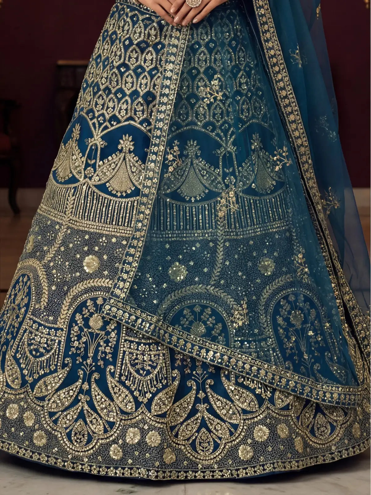 Tarani intricate embroidery closeup on butterfly net lehenga with golden detailing