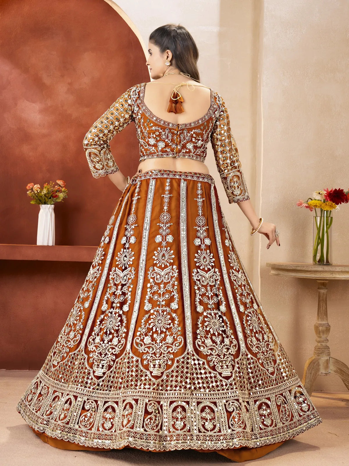 Tarani brown butterfly net lehenga full back view with embroidered design