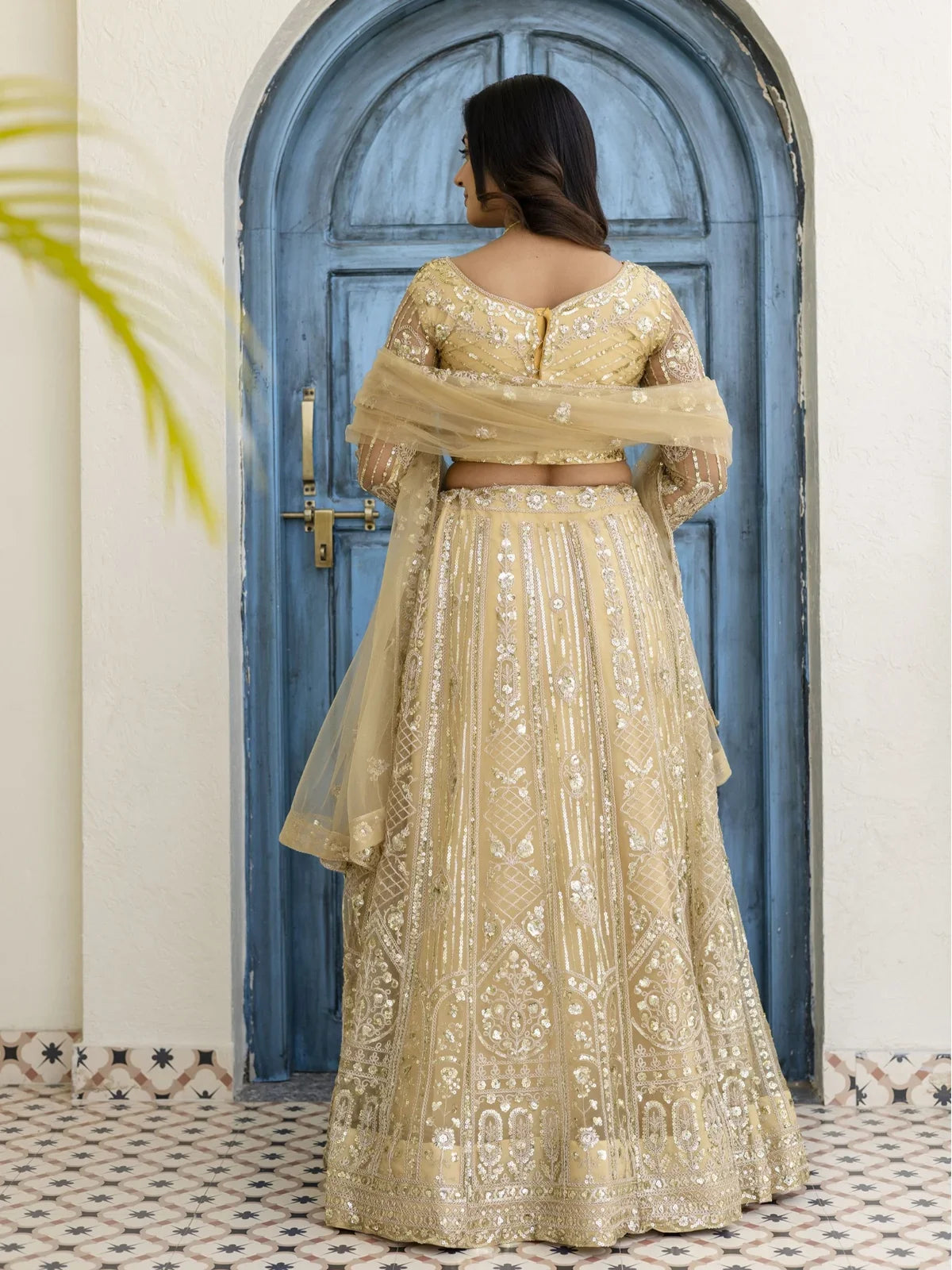 Tarani golden lehenga back view showing blouse and full embroidery detailing