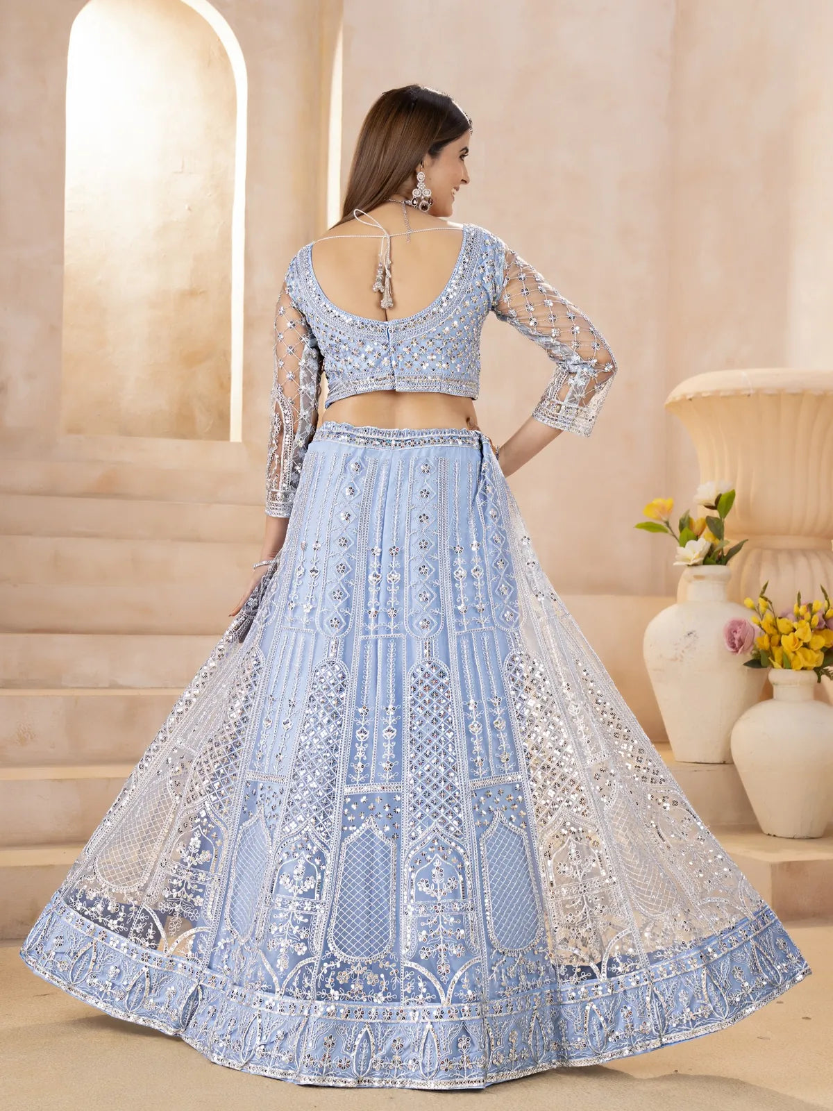 Tarani back view of butterfly net lehenga with detailed embroidery and tied blouse design