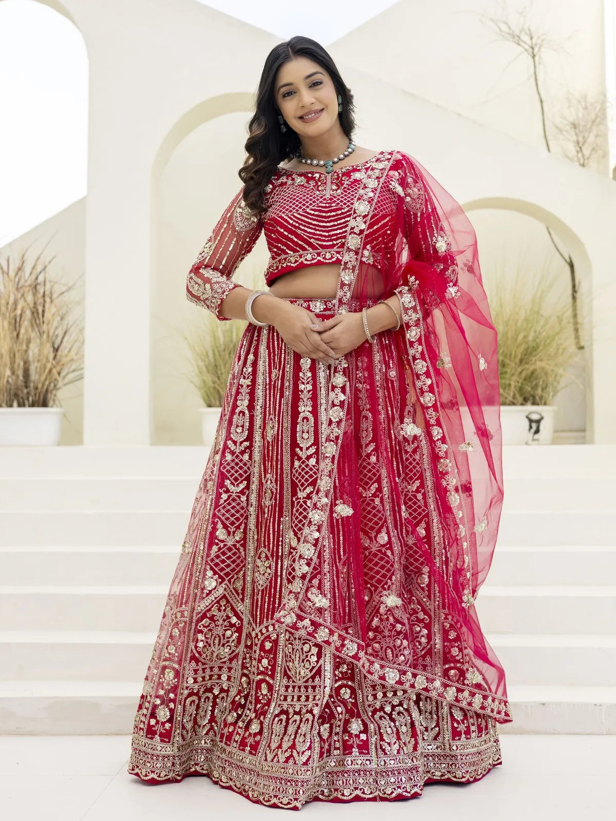 Tarani red butterfly net lehenga with blouse and dupatta in full view with embroidered detailing