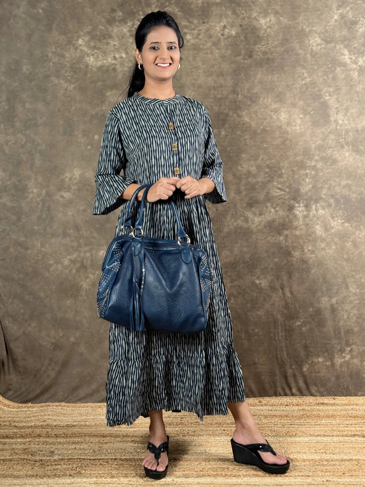 Tarani capsule cotton midi dress front view styled with handbag for casual outings