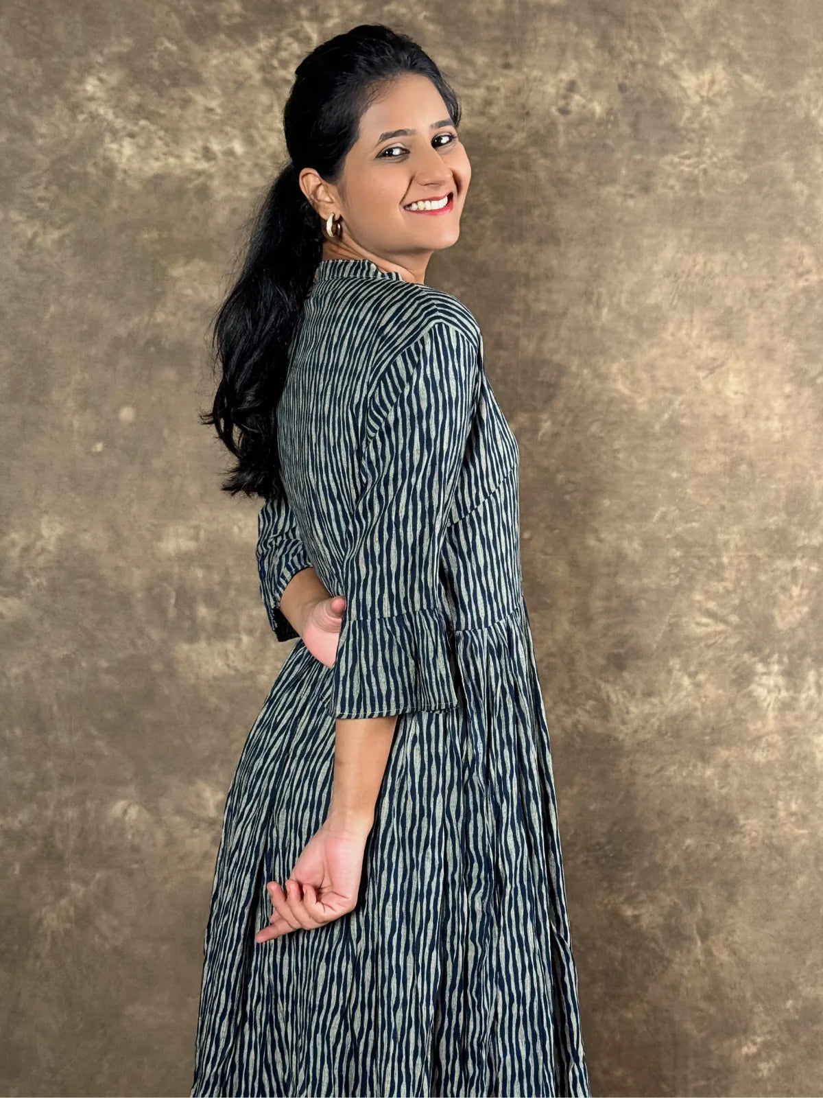 Tarani capsule cotton midi dress side view showing flowing silhouette