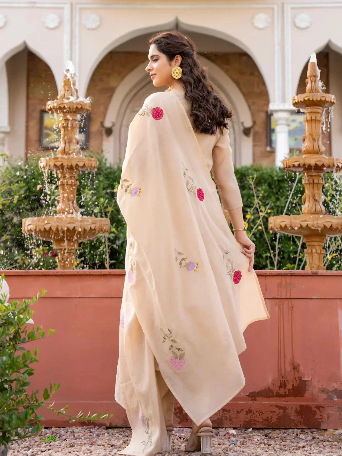 Back view of Tarani beige chanderi dress with floral embroidery and soft drape