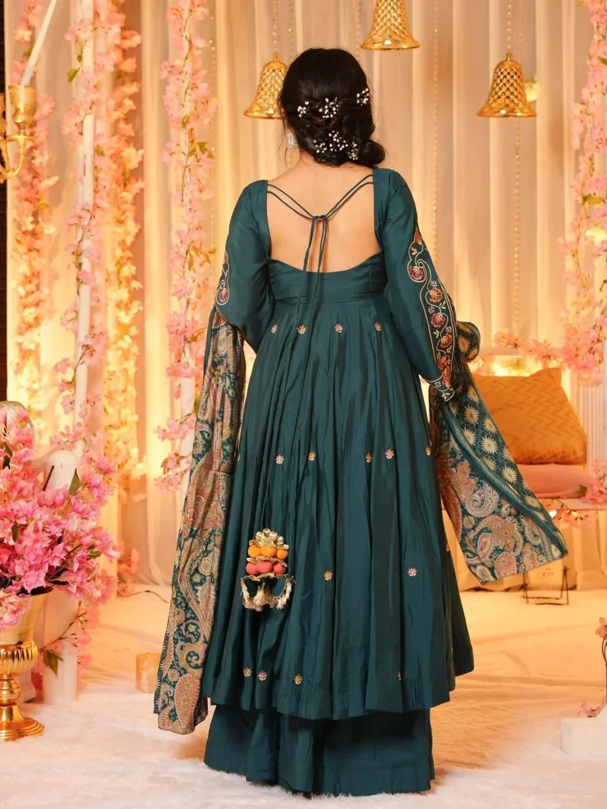 Back view of Tarani green chanderi dress with tassel tie-up and floral embroidered sleeves