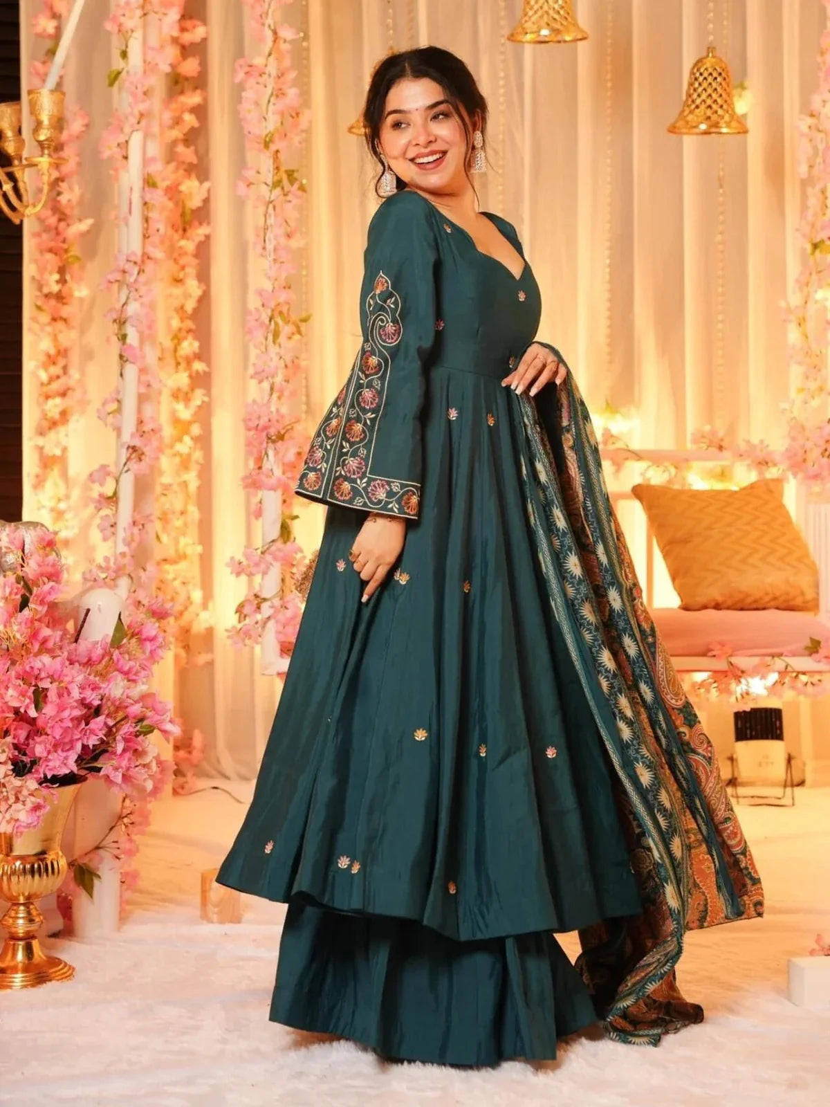 Side pose of Tarani green chanderi dress showing embroidered sleeves and flowy silhouette