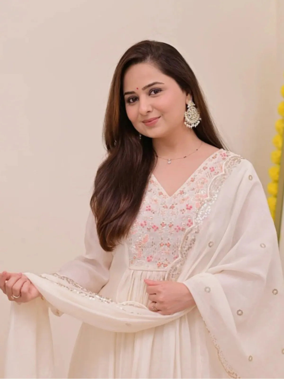 Tarani close up of neckline and embroidery on white chanderi festive dress