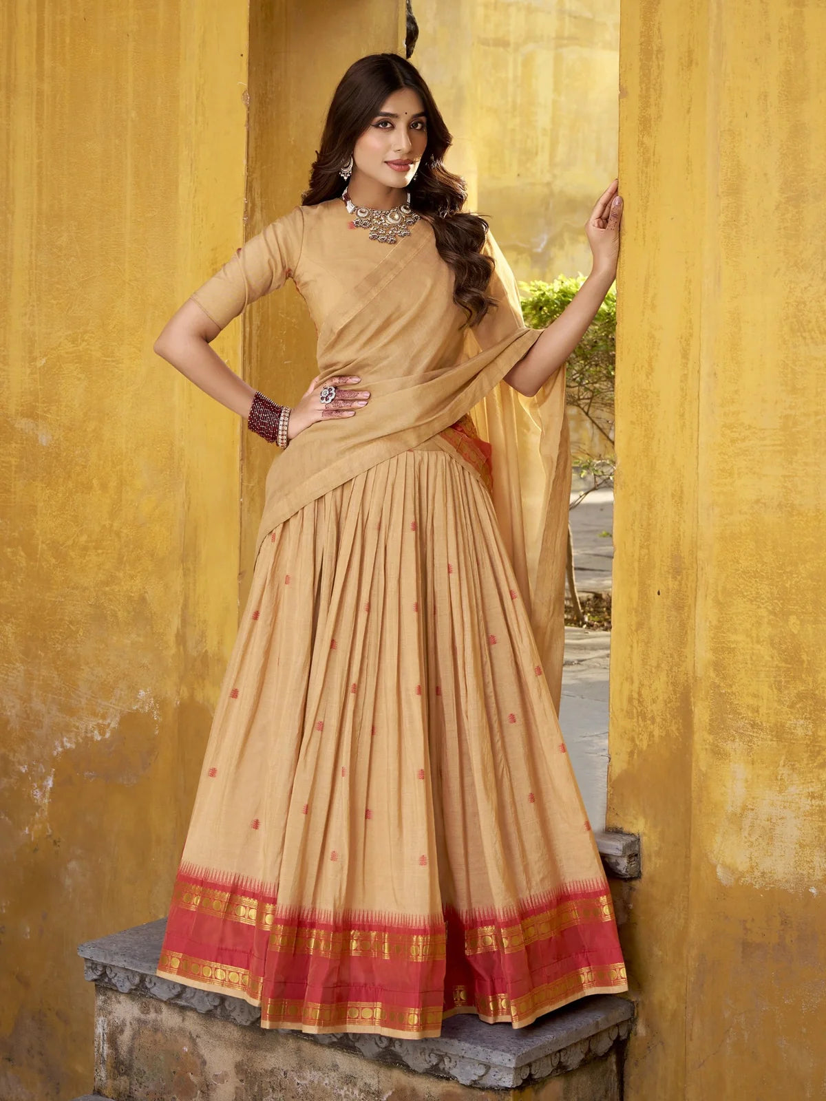 Tarani beige chanderi lehenga with zari weaving and red border styled for festive wear
