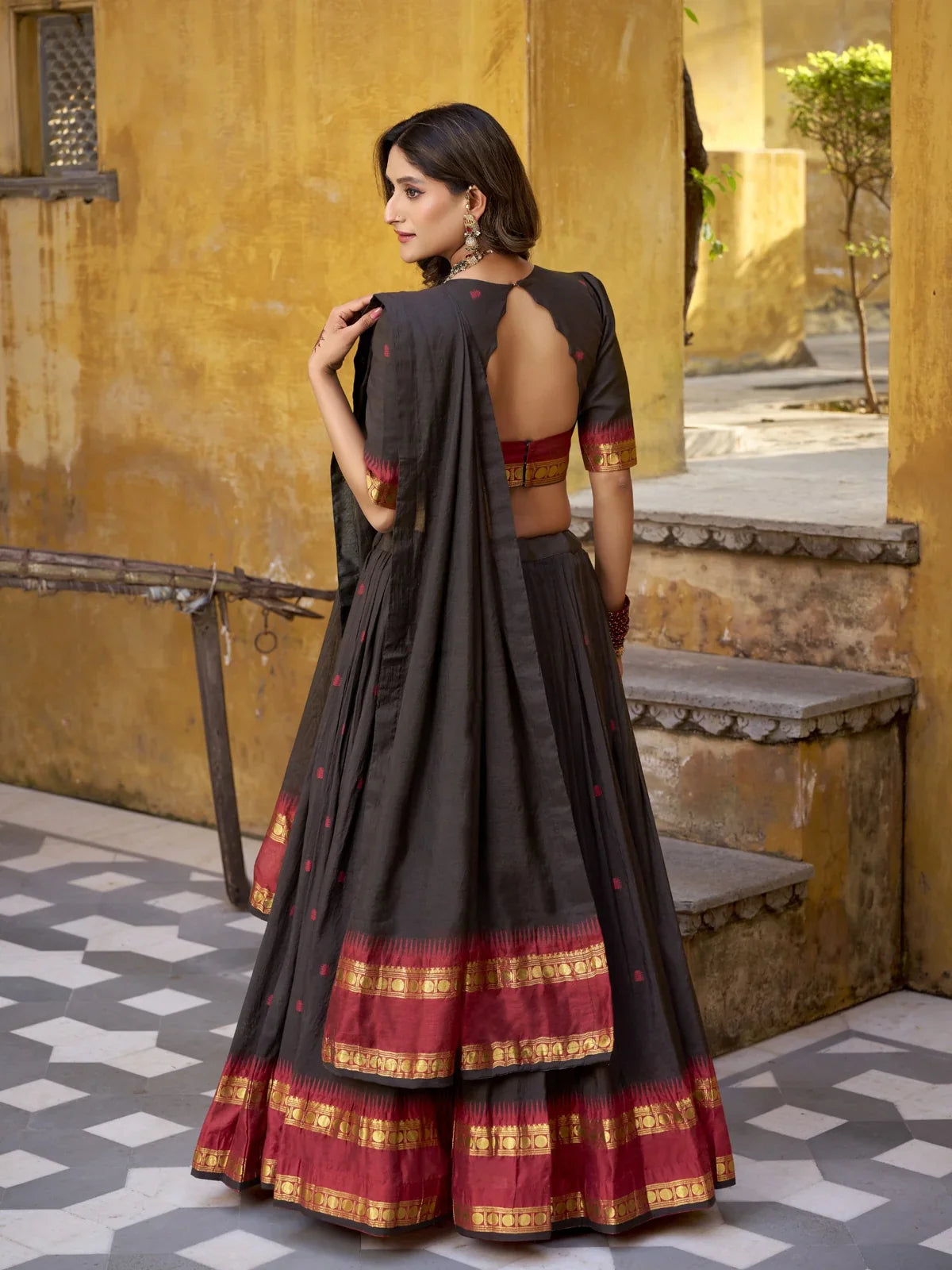 Back view of Tarani Chanderi lehenga with open blouse back and flowing dupatta