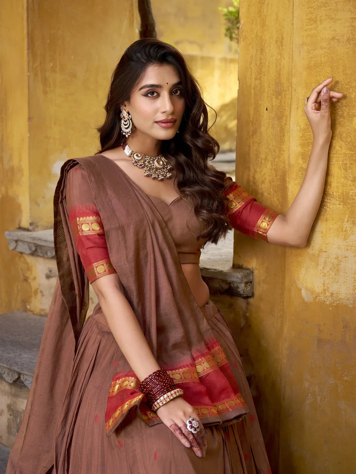 Tarani brown chanderi lehenga blouse close-up with zari work in red golden border