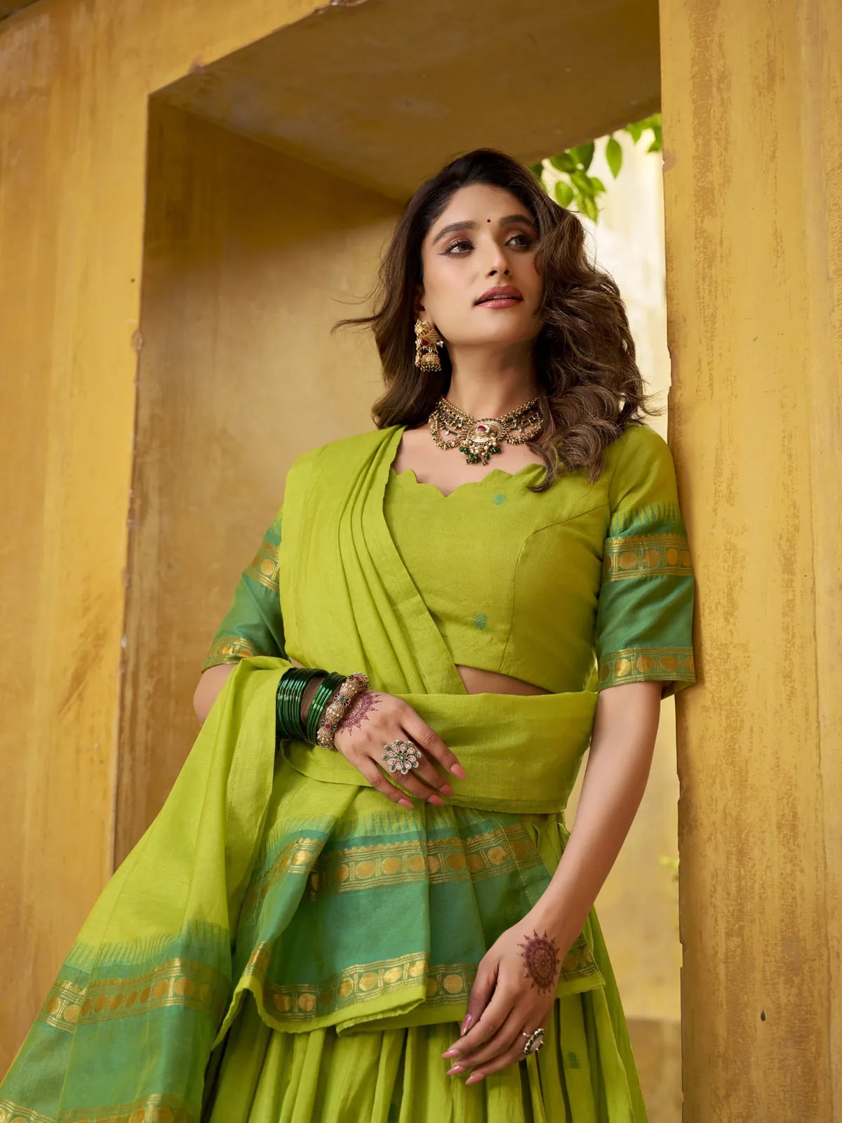 Tarani designer green lehenga in chanderi with zari border and blouse close-up showing elegance