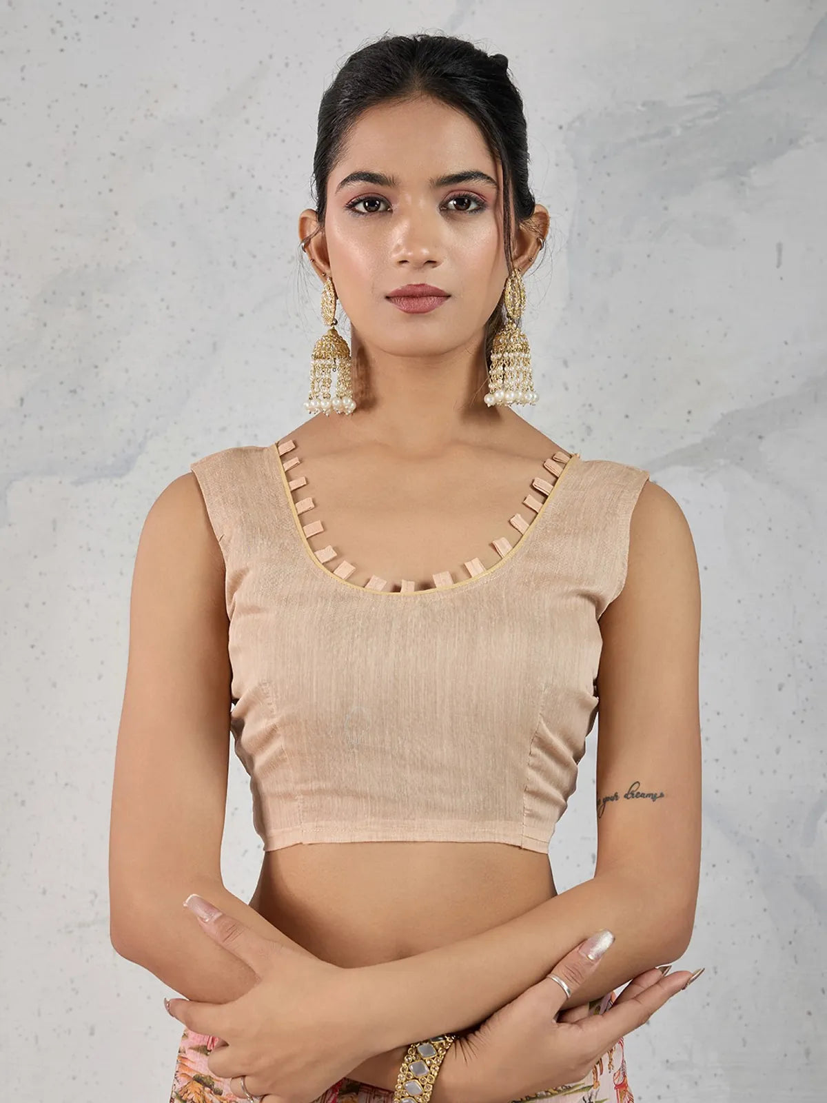 Tarani beige Chanderi saree upper body look with pearl jhumka and sleeveless blouse