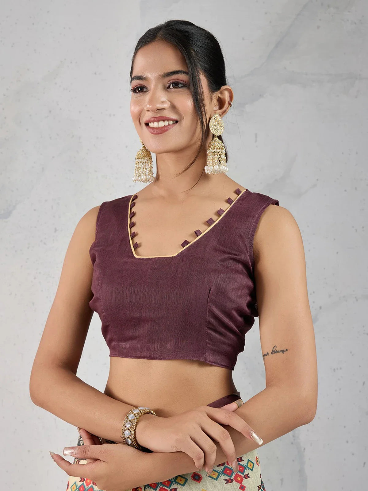 Tarani cream chanderi saree upper-body showing maroon blouse and elegant neckline