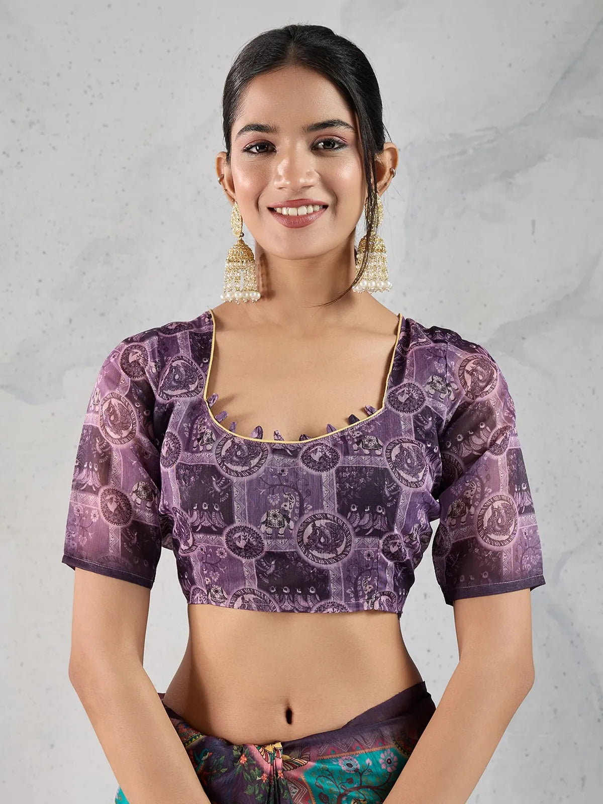 Tarani close-up of Chanderi saree blouse in purple with ethnic motifs – upper body view
