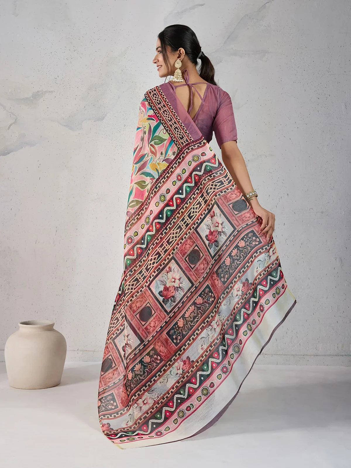 Tarani saree back-view showcasing complete drape and blouse design with elegance