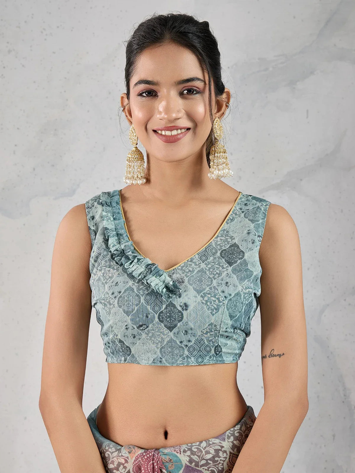 Tarani chanderi saree upper-body view with pastel motifs and elegant sleeveless blouse