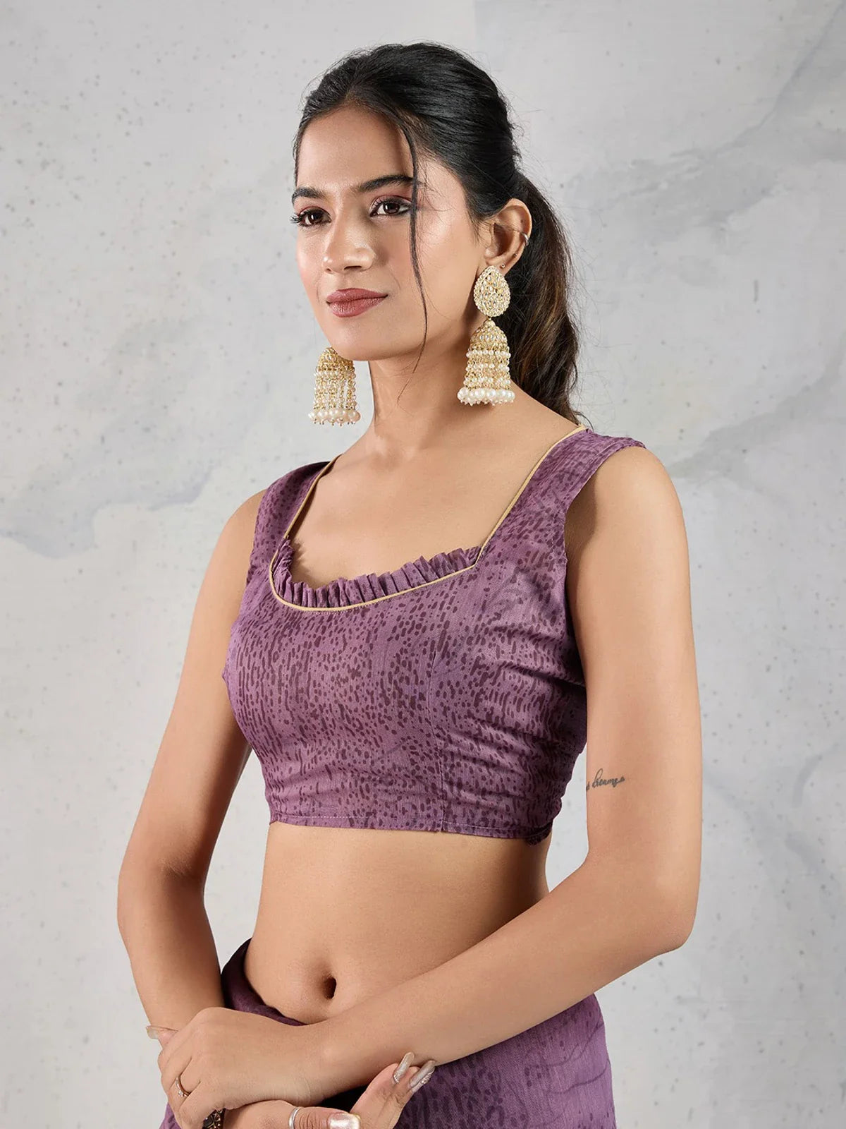 Tarani purple chanderi saree close-up showing blouse design with ruffle neckline and gold piping