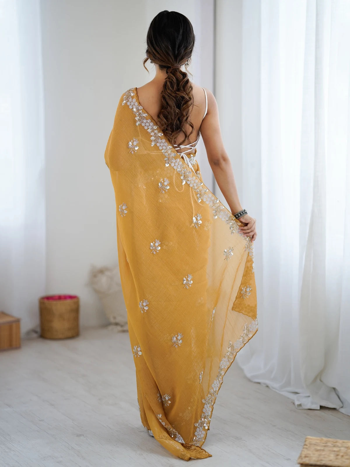 Tarani Amishi mustard chiffon crush saree back view with blouse style