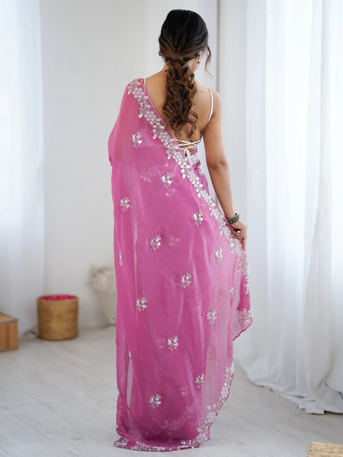 Tarani Mugdha pink chiffon crush saree back view with embellished border and flowing drape