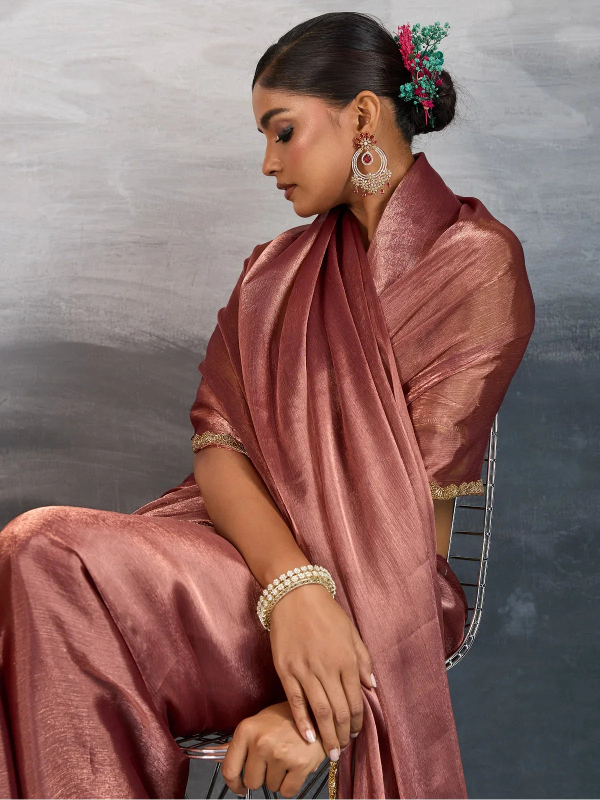 Tarani brown chiffon saree elegant side view showing soft drape and blouse lace work