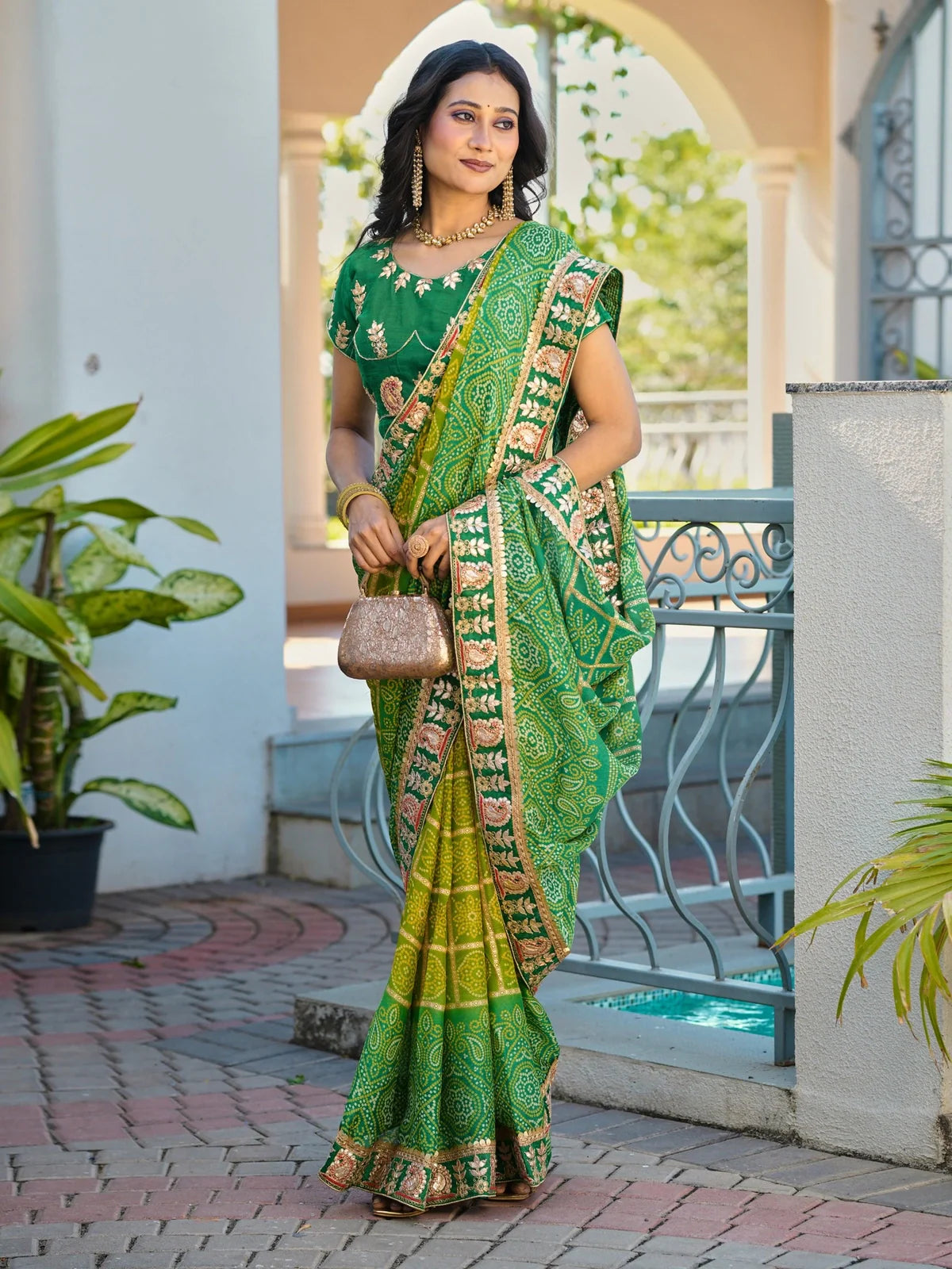 Tarani green chiffon saree with intricate embroidery and contrast blouse, perfect for festivals