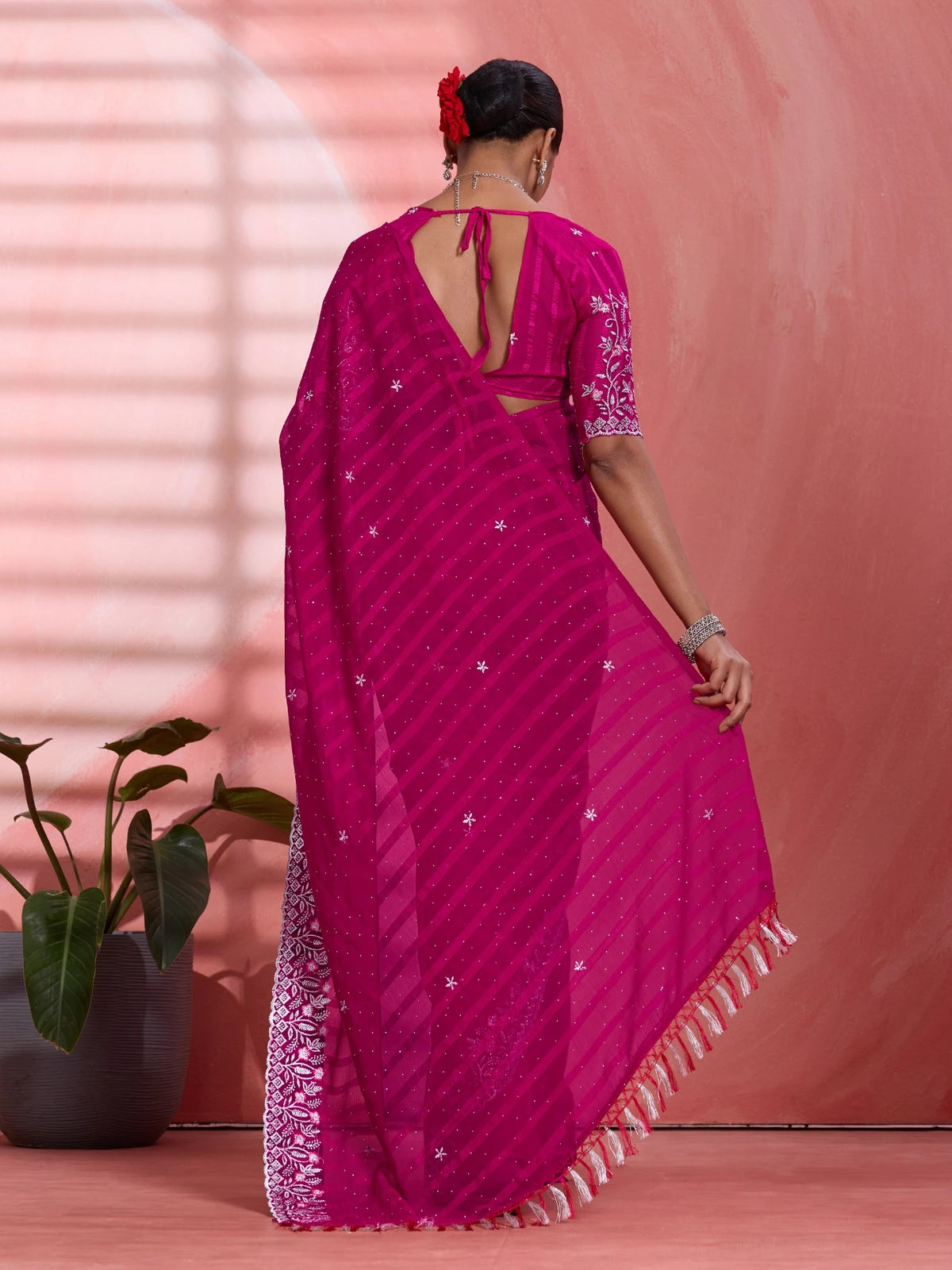 Tarani magenta solo chiffon saree back view with elegant blouse tie design