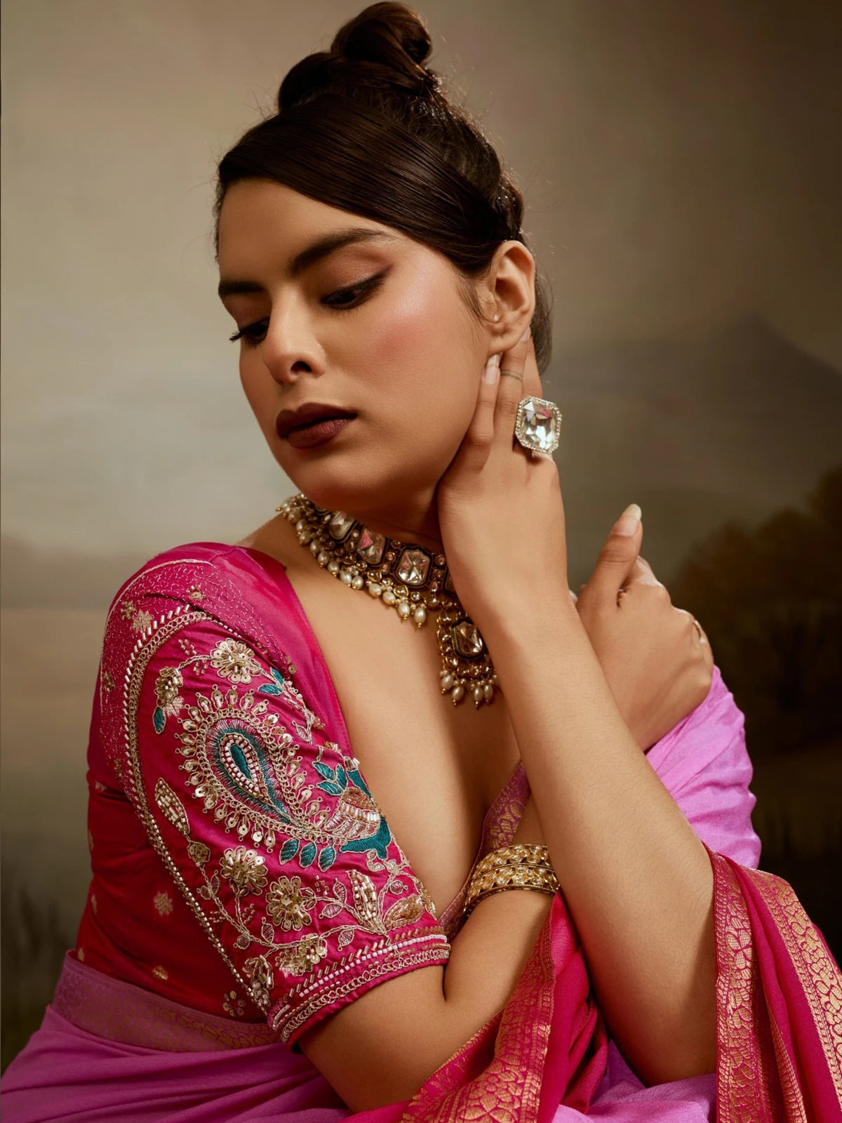 Tarani pink chiffon saree closeup showing zari border and elegant drape detailing